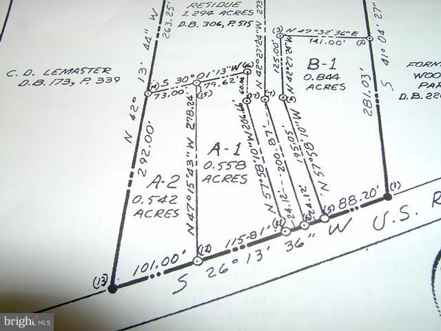 Currently an old farm house being sold as a Commercial Lot, setting on .56 acre. Utilities are available to the lot, located just off of the Falling Waters exit 23 off of I81. Located on a high traffic Rt. 11, making this the perfect location for a Commercial business. Area has both commercial & residential developing taking place, making this a unique find. Please call today for more information!
