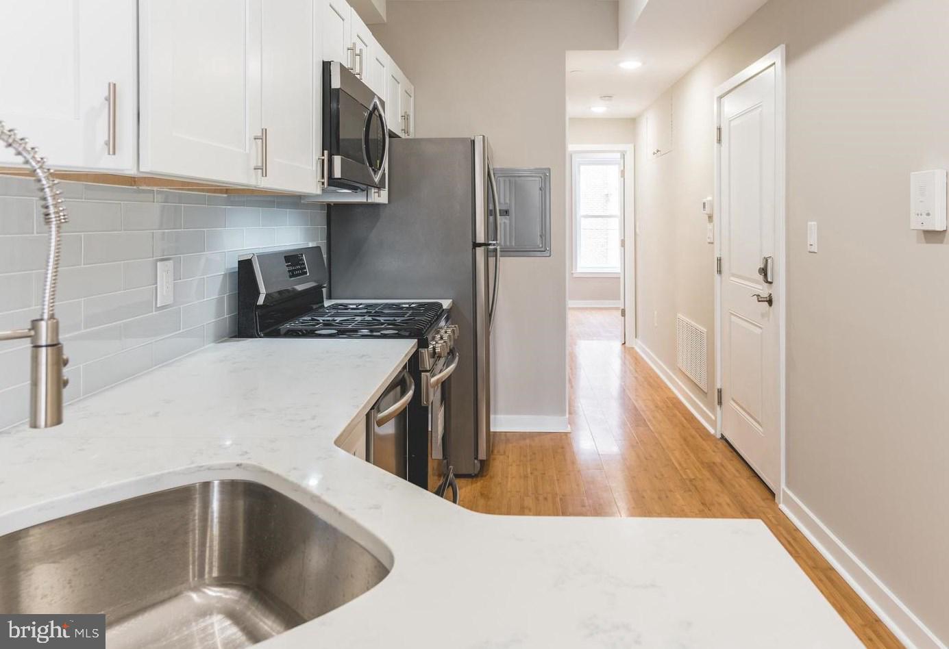Don't miss this beautiful and bright walk up apartment in a freshly rehabbed and conveniently located Art Museum area building! This gorgeous 1 bedroom 1 bath apartment features hardwood floors throughout, a stunning kitchen with glass tile backsplash and stainless steel appliances, beautiful bathroom, in-unit private laundry, central air/ heat, tons of natural light and a skyline view! Easy access to Center City, Kelly Drive, the Art Museum, University City, bus routes, subway, bars, restaurants, coffee shops, and markets. Tenant pays electric, gas, and water.
