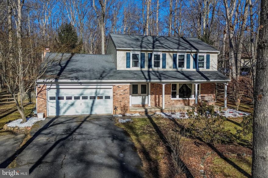 Located in a desirable lake neighborhood, this beautifully updated home sits on over one acre and offers a lifestyle surrounded by nature. Just steps from your door is the scenic lake, featuring 1 kilometer of walking paths, fishing, nature trails, and abundant wildlife including bald eagles and herons. Inside, the home features an open and inviting layout with hardwood floors throughout the main and upper levels, including newly refinished hardwoods in the foyer, living room, and dining room (Jan 2026). The kitchen offers Kemper cherry cabinets with exceptional storage, quartz countertops, expansive counter space with bar-height seating, an LG Instaview refrigerator, and a picturesque view of the garden and backyard from the kitchen sink. A cozy family room with a wood-burning fireplace opens to a stunning sunroom overlooking the backyard, while the 3-season room features TimberTech flooring added in 2024. The upper level offers generously sized bedrooms with hardwood floors, two fully updated full baths (2019), and built-in bookcases in two rooms. The finished lower level includes new carpet tiles and lighting (2023), providing additional living space. Numerous updates include R38 attic insulation (2016), sunroom renovation (2017), whole-house water filtration and softener system (2020), full kitchen and living room renovation (2021), new breaker box and fuses (2021), making this home a perfect blend of comfort, quality, and serene lake living. Close to shopping (Columbia & Rt. 40), Easy commute to Baltimore/DC/NSA/APL. Triadelphia Ridge Elementary School / Folly Quarter Middle School/ Glenelg High School!