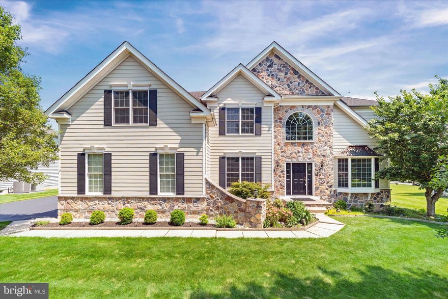 COMING SOON! Welcome to 915 Mather Drive in the sought-after Red Lion Chase community. This beautiful Toll Brothers-built home combines timeless elegance, functional design, and spacious living.

From the moment you arrive, you’ll be captivated by the home’s stately curb appeal, featuring a striking combination of stone and tan siding, accented by black shutters and a bold black front door. Step inside to a grand two-story foyer with gleaming hardwood floors and an impressive turned staircase with balcony overlook, setting the tone for the craftsmanship found throughout.

To the left, French doors open to a private office, while to the right, a formal living room flows into a sophisticated dining area featuring Brazilian cherry hardwood floors, bright white wainscoting, and elegant white columns, making it ideal for hosting and entertaining.

At the heart of the home is the well-appointed kitchen, where rich cabinetry, sleek black granite countertops, and stainless steel appliances create a warm and welcoming space. A center island and adjoining dining area offer casual seating, while sliding doors provide access to the rear yard. The kitchen opens seamlessly to the dramatic two-story great room, where oversized windows fill the space with natural light and a beautiful brick fireplace with a white mantel creates the perfect focal point for cozy evenings at home.

A secondary staircase from the great room leads to the upper level, where the expansive owner’s suite is tucked away for privacy. This elegant retreat features a dedicated sitting area, Brazilian cherry hardwood floors, and refined white columns. The en-suite bath includes dual vanities, a soaking tub, and a separate standing shower. Down the hall are three additional spacious bedrooms, including one with a private full bath and two connected by a Jack-and-Jill bath.

Additional highlights include a main-level powder room, laundry area, and a spacious 3-car garage. The full unfinished walk-out basement, complete with exterior stairs leading to the backyard, offers excellent potential for future living space, recreation, or storage.

A notable upgrade includes recently updated windows and doors, offering enhanced energy efficiency and added peace of mind.

As a resident of Red Lion Chase, you’ll enjoy access to premium community amenities including a clubhouse, fitness center, swimming pool, tennis courts, pickleball courts, basketball courts, and a playground.

All of this is conveniently located with easy access to Route 1 and I-95, just minutes from restaurants, shopping, Christiana Mall, and local parks.

915 Mather Drive offers comfort, space, and classic style in one exceptional package. Priced to sell, this is an opportunity you do not want to miss. Schedule your private tour and make this house your next home.