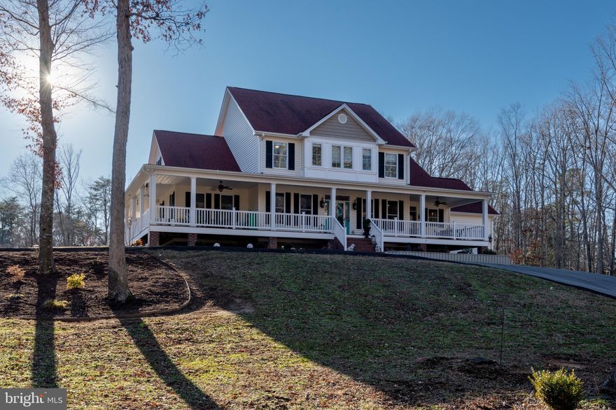 Enjoy modern farmhouse living with a luxurious twist in this completely custom countryside home. Tucked away on just about five acres, you will love enjoying serene privacy without sacrificing easy access to shopping, dining and NAS Pax River.  Like living in your own HGTV episode, this home is truly one of a kind, first welcoming you with a circular paved driveway, maintenance-free 900+ sq ft. wraparound porch and plenty of curb appeal as far as the eye can see. From the moment you step inside this nearly 4,000-sq.-ft. home, prepare to be wowed. The open concept entertainment space is perfect for hosting friends and family where guests will love gathering around the fireplace or at the table in the generous sized dining room.

Rich wood flooring, luxurious crown molding and updated fixtures throughout are highlighted by warm natural light spilling into the home. An effortless flow guides you from the entertainment space and into the fabulous kitchen.  Built for the home chef, this eclectic space features custom touches including soft close cabinetry, beautiful backsplash, stainless-steel appliances and a pantry reminiscent of a country store that can double as a bar. The entertainment space continues outside in the large, backyard full of opportunity whether you’re looking to add a pool, workshop or lounging space – the possibilities are endless!

Back inside, equal attention was given to the private family quarters, starting on the main floor where you’ll find a spacious guest room as well as the primary suite with spa-like ensuite. Rinse off the day in the standalone shower, soak your sore muscles in the garden soaker tub. Upstairs, find another living space, three more bedrooms sharing a spacious bath, as well as two bonus spaces – perfect as a home office, playroom or extra lounging area and additional storage. The amenities at this home continue, including in wall speakers in the kitchen, dining room, primary bathroom, four outdoor speakers, recessed lighting and ceiling fans on the porch.  In this Savant Smart Home
 – all are safeguarded by four 4MP Camera Surveillance System and thirteen Programable Lighting loads.  There’s so much to see in this one-of-a-kind home, and it won’t last long. Don’t let this one pass you by! Oh – and no HOA!