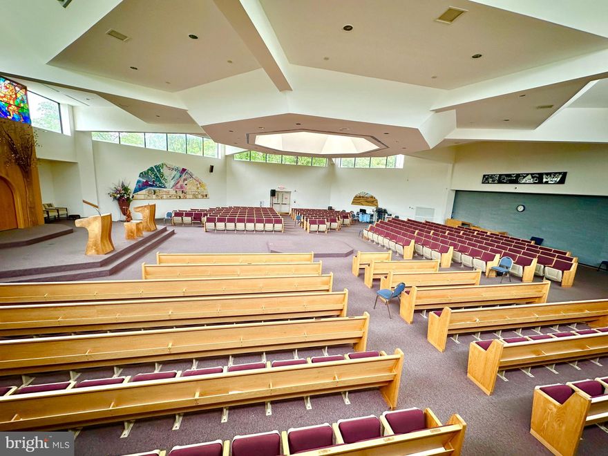 A rare opportunity to own a large religious complex in Montgomery County.  The Kehilat Shalom synagogue is an  ±18,423 SF complex, sitting on ±3 acres with 266 feet of frontage on Apple Ridge Rd. The complex was constructed in two phases.  The first phase, 9153 SF, built in 1980, offers a porte cochere entrance, with security doors opening into a bright lobby, with decorative windows onto the reception desk and administrative offices.  Also included is a spacious office ideal for leadership, and a large multi-purpose space with a room divider, currently configured as a chapel and conference room.  Through the lobby is the social hall, kitchen, library, three classrooms, and restrooms.  High ceilings and custom clerestory windows make the social hall a unique and attractive space for ministry and celebration.  The fully-outfitted commercial kitchen can handle food prep for large functions, and includes a gas range, convection oven, plenty of preparation surface, and grease trap (the dishwasher requires repairs). There is also a loading dock with electrical hook-up for catering trucks.  The roof has two elevated sections of architectural shingles that are in good condition, and the remaining lower areas were re-shingled in May, 2025.

Phase two of the complex, built in 1991, comprises 9270 SF and offers a spacious sanctuary, entrance lobby, gift shop (currently used for storage), a multi-purpose space, and a large storage room.  What makes this worship space extraordinary is its expandability.  The sanctuary, as currently configured, seats 385 in stadium-style seating. To expand the sanctuary for another 183 seats, simply retract the room divider.  To gain another 402 seats, retract the dividing wall to the social hall.  At the height of its use, the sanctuary was regularly expanded to encompass the multi-purpose room and the social hall -- creating seating for nearly 1000.  

 The complex includes a sprinkler system and a state-of-the-art system.   The HVAC system is located on the roof and supplies electric central heat and air, along with supplemental window units (two of the roof units are not currently operational).  The roof of phase two is a flat roof of 125 square TPO with recent repairs and a newer EPDM replacement over the entranceway.  Electric comprises four 400-amp panels and one 225-amp panel.  Parking is paved and striped for 98 vehicles, with several handicap-designated spots. (NB: there is a parking easement for the childcare facility next door.) The property is zoned R-200 (residential, with few commercial uses; house of worship permitted by right).  The property is exempt religious; with water quality protection and solid waste taxes. Tenants are on a month-to-month basis. Some chattels will convey with the sale.  The seller has its own LOI and closing agent.  To be sold as is.