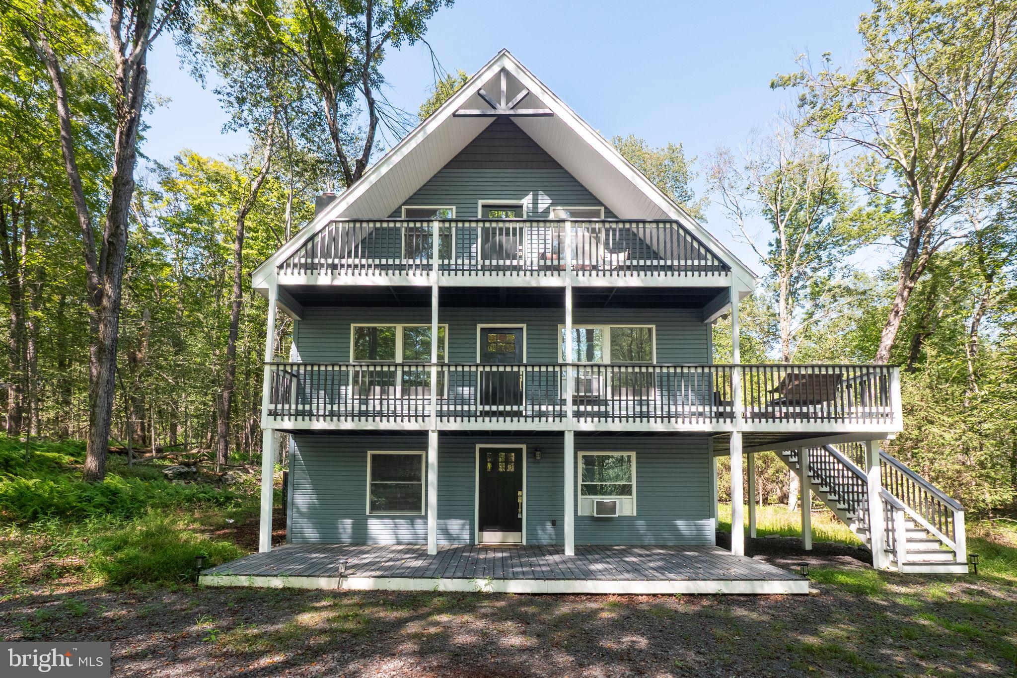 Nestled within the serene, gated enclave of Big Bass Lake, this beautifully remodeled 4-bedroom, 2½-bath chalet-style residence offers a luxurious retreat surrounded by nature’s beauty. Set against a backdrop of lush trees and tranquil woods, the property invites you to experience a lifestyle of comfort and elegance. Step inside to discover a thoughtfully designed space that exudes warmth and sophistication. The cozy gas fireplace serves as a focal point, perfect for intimate gatherings or quiet evenings at home. With ample room for relaxation and entertainment, this residence is ideal for those who appreciate the finer things in life.
Offered fully furnished and boasting great Airbnb potential, this home provides exceptional versatility for personal enjoyment or investment. The community amenities elevate this property to a new level of exclusivity, including a state-of-the-art clubhouse, indoor and outdoor pools, tennis and volleyball courts, and scenic jog/walk paths. The 24/7 gated security ensures privacy and peace of mind, allowing you to truly unwind.
With beautifully landscaped grounds, this home offers plenty of outdoor space to enjoy the fresh mountain air. Whether you’re sipping coffee on the porch or hosting a barbecue with friends, the natural beauty surrounding you creates an idyllic setting. And when adventure calls, you’re just 30 minutes from ski resorts and wineries—making it the perfect year-round escape.
This property is not just a home; it’s a lifestyle choice that embodies luxury, comfort, and the joys of nature. Experience the perfect blend of elegance and tranquility in this remarkable mountain retreat.