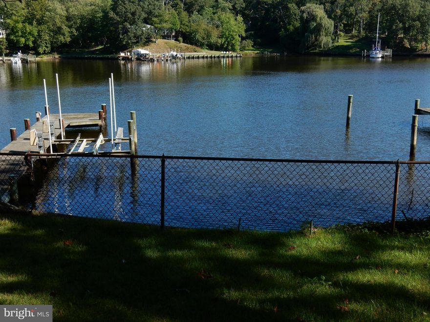 Opportunity Knocks!  Rare Find A Waterfront with a 2 Car Garage & Gated Driveway, Tons of Parking & Storage.  Nice Size Lot, Unbelieveable Views Tranquil and Gorgeous, Deep Water Dock with Electric and Boat Lift, Sandy Beach,   Unique also for waterfront is the size of the bedrooms and the closet space. Very Generous size living room and Kitchen and dining area.  Come and make it your own.