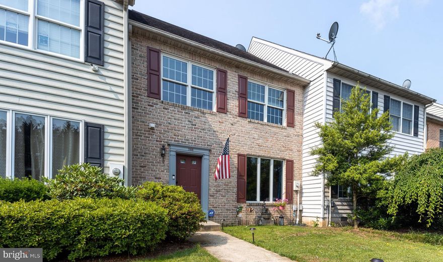 Lovely, brick front townhome in the popular Spring Mills sub-division.  Don't let it fool you, there is 1672 square feet of living space here!  Lots of flexibility with this floor plan.  A sunken foyer provides a warm welcome to your new home.  The living room, at 15 x 21 feet, is large enough for a formal living/dining combo.  The dining room could be a casual family room with gas fireplace if that fits your lifestyle.  The kitchen features a new dishwasher, refrigerator and microwave.  The center island is great for party buffets, casual meals or baking cookies.  There's also a pantry, utility closet and access to the back yard for easy grilling.   A half bath on this level is a great convenience.
The open, wide staircase leads to the bedroom level where you will find a laundry center in the hallway.  
The primary suite offers a cathedral ceiling with fan/light unit.  Lots of room here for large bedroom furniture.  The attached bath is spacious with a tiled whirlpool tub/shower unit and large double vanity with make-up nook.  The attached walk-in closet for large storage space.
Additonal bedrooms provide space for family, guests or home office space.  Filled with natural light they are great for play 
The community offers an in-ground swimming pool, tot play lot, tennis courts and walking path. Paved streets are wide and bike/walking friendly.  It is within easy access to the retail and restaurants in the Spring Mills area and I-81 exit 20 for commutes into Maryland or Virginia.  
The cul-de-sac location offers guest parking and no through traffic.
Visit this home today, it won't last long!