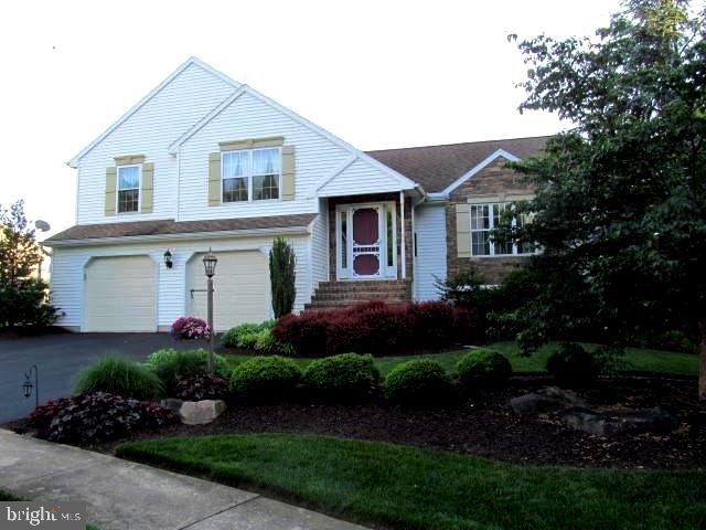 Incredible split level with perfect attached 3 car garage a mechanics dream. Beautiful view off 16x16 deck overlooking stream. Covered front porch, updated furnace, 200 AMP electric, 1/3 acre lot in cul-de-sac, thermo tilt- in windows, potential to finish off lower level family rm., CAC, home warranty, 2 1/2 baths, refrigerator, washer/dryer, built-in microwave all stay.