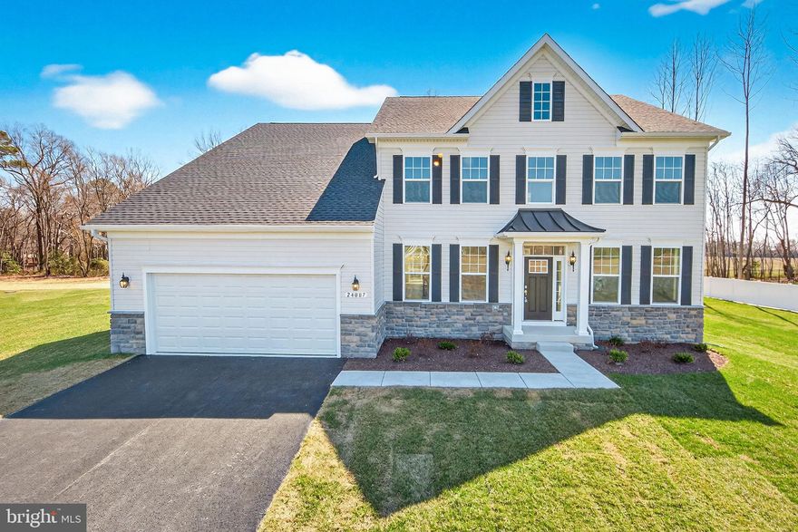 Move-In Ready! Multi- Generational Home.  Welcome to the spacious Linden – a great option for families looking for a multi-generational floorplan. 5 bedroom – 3 bath home.  This home combines farmhouse and Craftsman styles, offering charm and functionality.  With over 3,840 sq feet there is plenty of room to spread out.  Nestled in a beautiful serine setting. Canaan Woods is known for its friendly atmosphere and well-maintained common area, ensuring a welcoming environment for all.  The main floor includes a foyer, library, formal dining, large gourmet kitchen featuring an abundance of cabinets, upgraded cabinets and countertops, Samsung stainless steel appliances including double wall oven, dishwasher, refrigerator, cooktop.  Adjacent to the kitchen is a beautiful breakfast area with a lot of windows allowing for a bright and airy eating area.  First floor bedroom/choice room is perfect for overnight guests, office or just a place to go and relax.  The wide oak stairway leads to the upper level bosting an Owners Suite/Retreat including tray ceiling and recessed lights, spa like owners’ bath with over-height vanity cabinets, free standing tub, walk in shower with handheld 3 function spray, rain head & upgraded ceramic tile in shower and on floor, large walk-in closet. Three additional bedrooms and an upstairs laundry room. While the combination of carpet, luxury vinyl plank and tile flooring add both style and practicality.   LVP flooring in foyer, dining room, great room, kitchen, breakfast area, walk-in pantry, arrival center and laundry room. Unfinished basement with 9 ft ceilings, rough-in for future bathroom and a 6 ft areaway with 5 ft sliding glass door. Located in the Milford School District.  Well water, septic and all electric. . Some photos are virtually staged.  Please contact on-site builder sales manager for details on incentives with use of preferred lenders.  Also ask about Military appreciation incentive for active / retired military only). On-site, unlicensed salespeople represent the seller only.