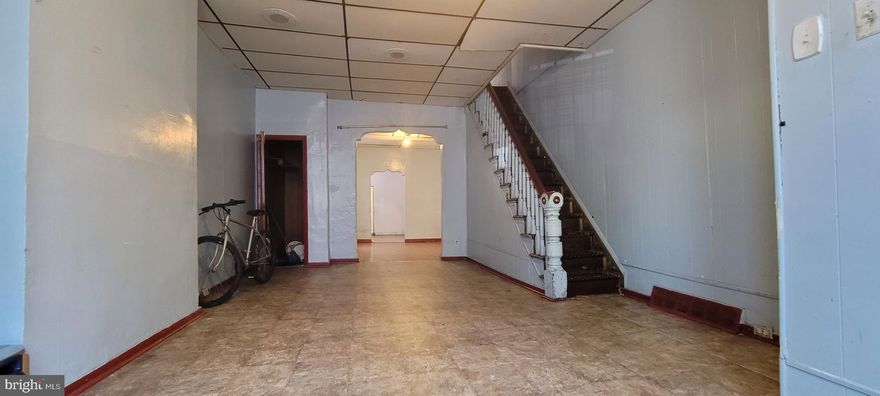 Welcome to Dickinson Narrow section of South Philly.  This 3 bedrooms with a bonus attached room that can be use as a 4th bedroom,  1 bath, over 1200 sqft gem,  offer a high ceiling and  an open floor plan through out the first floor.  This gem could use a little TLC.  Other recent home sales in the area are in the mid $400s range and higher. This home is perfect for 1st time buyer or investor. Great location. Locate on a big street.  This home is SOLD Strictly in AS IS Condition. Buyer's to do their due diligence.  Buyer's are responsible for U&O cert. and any required lender repairs.