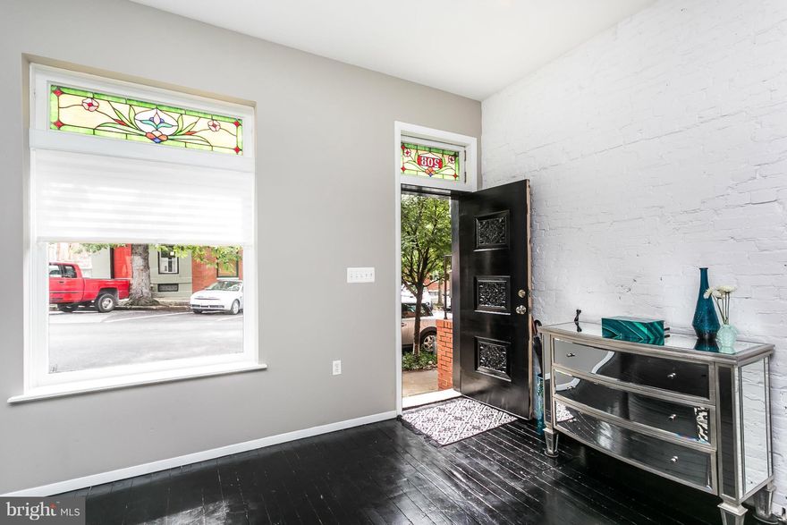 14' wide home w/gleaming wood floors, high ceilings & exposed brick. The LR & DR are open to the gorgeous kitchen w/ breakfast bar, granite & stainless apps which leads to an urban courtyard oasis- perfect for entertaining! Upstairs are the laundry, 2 large master suites & 2 breathtaking bathroom retreats. Located on a tree-lined street just steps to the park & an easy walk to Canton & Fells Point