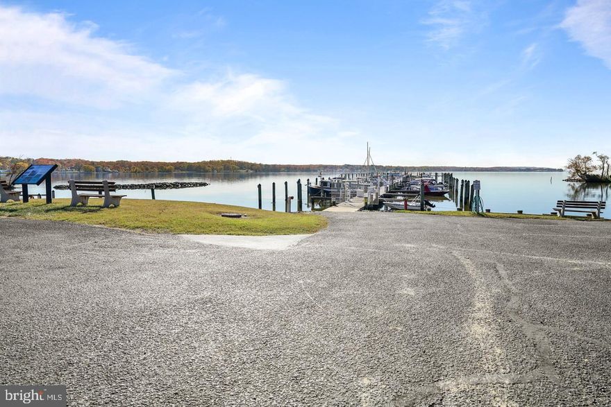 Great Investment Opportunity! Welcome to this charming two-level WATER VIEW condo with TWO DECKS in a sought-after, water-privileged community at the Head of the Chesapeake Bay. Enjoy your morning coffee on the inviting front porch, then step inside to a bright, open floor plan ideal for both relaxing and entertaining. The spacious living room flows into the dining area, perfect for hosting guests. The well-appointed kitchen offers ample cabinetry, generous prep space, a center island with extra storage, and a breakfast bar for casual meals. A convenient powder room completes the main level. Downstairs, the spacious primary suite features a large walk-in closet and direct access to a full bath with tub/shower combo, ideal for unwinding after a long day. A second bedroom provides flexible space for guests, an office, or personal retreat, with hallway access to the shared bath. Both bedrooms offer sliding doors to a private lower deck with serene wooded views. Condo fees include roof, deck, exterior, and stair maintenance. The condo is currently leased to a long-term tenant at $2,000/month (no short-term leases allowed), making this a fantastic turnkey investment. This vibrant waterfront community features a community pool, two tennis/pickleball courts, private marina with buy/rent options, boat launch and storage, watercraft storage, fire pit, and picnic areas. Located in the quaint town of North East, you’re just minutes to local restaurants, antique shops, state parks, and more. Recent updates include a new HVAC compressor (2025) for added peace of mind. Enjoy the perfect blend of comfort, convenience, rental income, and coastal living—schedule your private tour today!