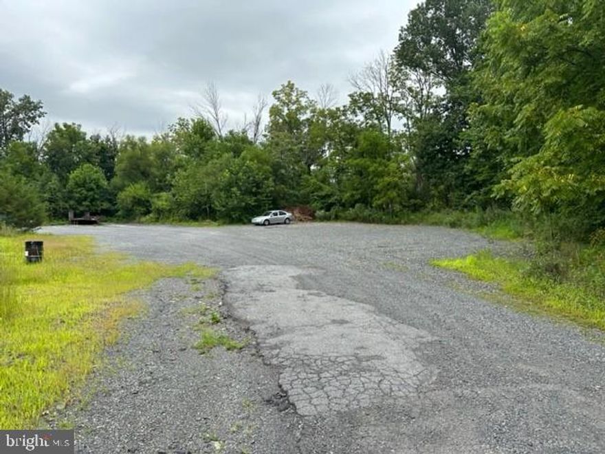 Fenced in back parking lot for storage usage located off a  well traveled road on Rte. 29.