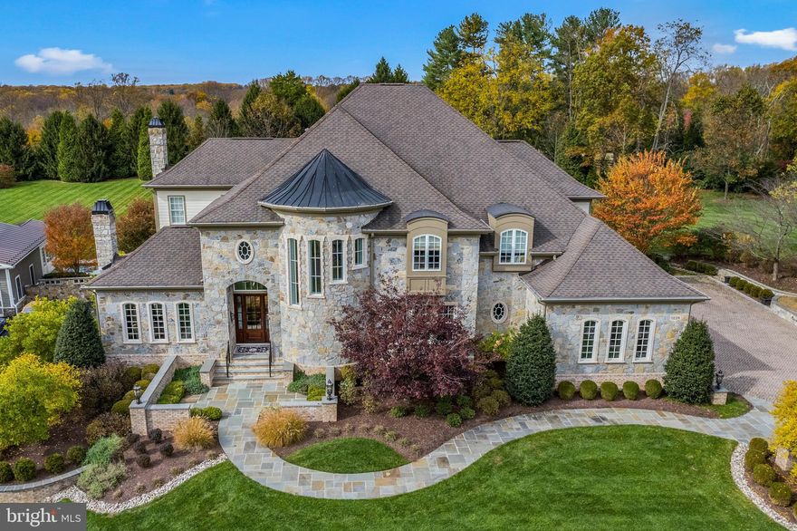 Welcome to 11226 Kinsale Court, where unparalleled construction and design are found throughout the entire residence. French Country architecture, stone, slate, brick, and Hardiplank envelop the exterior. The house backs to Forever Farmland which will never be developed. The driveway pavers have a 4-inch concrete underlayer base, and LED edge lighting along the driveway leads to blue stone walkways that guide you to the custom front courtyard, featuring brick walls and blue stone capping. The Fine Arts exterior lighting and professional landscaping accentuate the true beauty of all of the exterior features. Inside you will find thoughtfully designed interior detailing, beginning with the dramatic two-story foyer featuring marble floors with an intricate mosaic. The curved solid cherry staircases are the showpiece of this area, incredible in design and style. Gleaming South American tigerwood floors throughout the first and second floors with gorgeous colorway. The living room is the center of the home and offers timeless style with a two-story design and architectural windows offering views into the main level from upstairs. Featuring a professionally installed mirror flanked by gorgeous sconces and a Fine Arts chandelier, this room is a true masterpiece. The main kitchen features two large islands with exotic granite counters and contrasting perimeter cabinets. Amenities include a Wolf dual fuel range with six burners, a Viking hood, a Sub-Zero built-in refrigerator/freezer, a Sub-Zero ice maker in the pantry, two Bosch dishwashers, and many pull-out soft close drawers. The first floor level includes a dining area, family room, butler’s pantry, offices, and solarium featuring extra-height windows allowing for views of the lush rear yard. As you travel up the grand staircase, you will be greeted by architectural detailing allowing views to the lower level. The owner's wing spans the entire rear of the home offering unobstructed views and lots of natural light. The owner's bedroom on one side, the dressing area in the middle, and the owner's bathroom flow effortlessly. The connected upper-level laundry room provides perfect convenience. Each additional bedroom has an en-suite bathroom and large closets. The lower level offers what could be an in-law suite featuring a full kitchen with a Sub-Zero refrigerator, Wolf cooktop and oven, Bosch dishwasher, a bedroom with en-suite bathroom, and level walk-out access to the rear patios and yard. Additionally, there is a game room, gym, extra room with another en-suite bathroom, and theater room offering sound deadening drywall, terraced seating, professional Runco projector, and surround sound system. Access all three levels using the oak-encased hydraulic elevator, chandeliers are on light lifts and there are two Tesla wall-mounted car chargers in the garage with overload protection while using both simultaneously. A 45kw Generac generator with an automatic transfer switch provides whole house coverage, so you will never have a moment without power. No expense was spared with the construction, maintenance, and upgrades of this magnificent home. The non buildable preservation parcel behind the home also conveys, see attached deed.