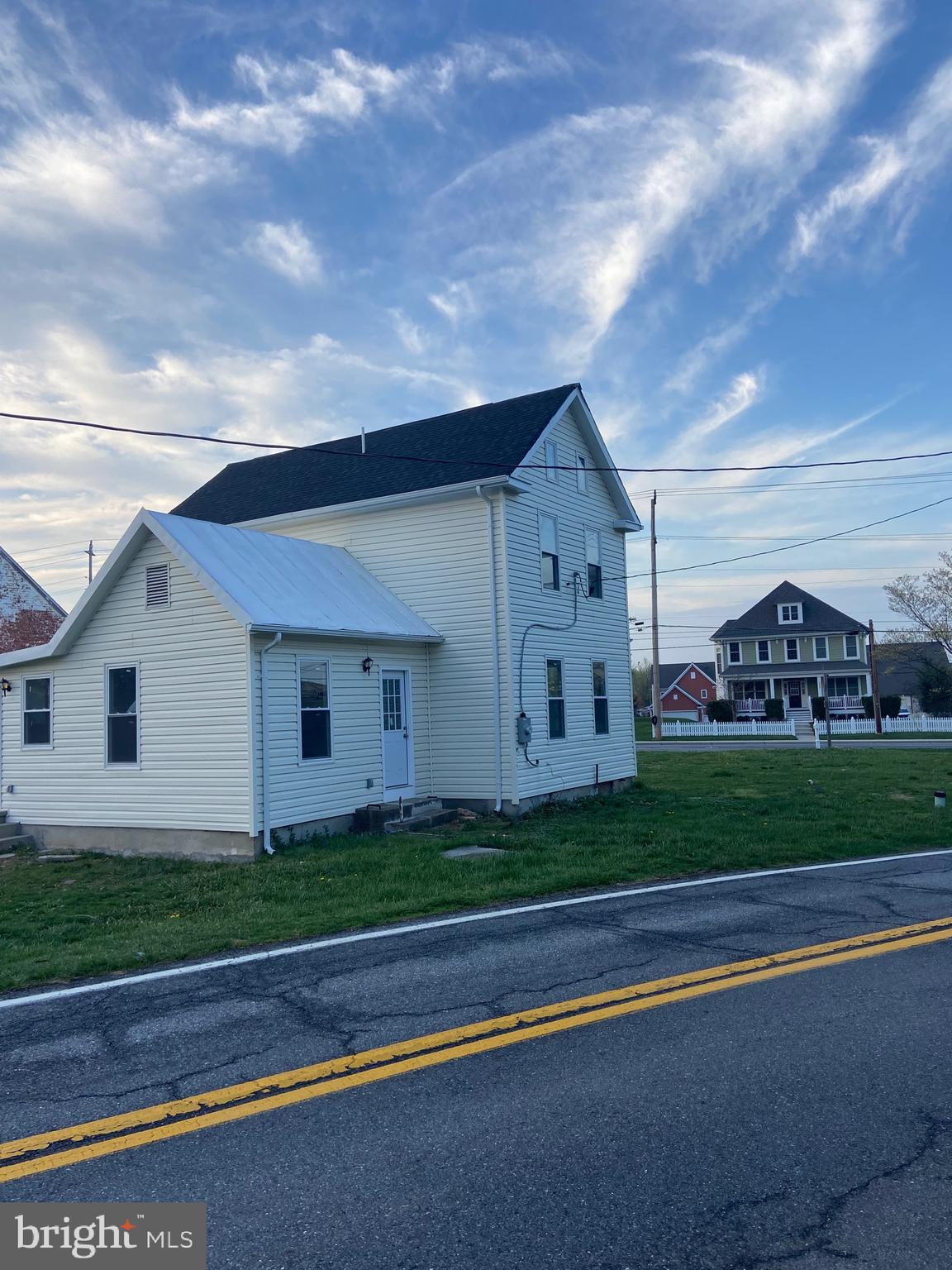Completely renovated commercial property ideal for both retail and office use, located in Urbanna at the intersection of Urbanna Pike and Urbanna Church Rd. Features include new HVAC, water heater, plumbing, and upgraded windows/doors. The first floor offers an open space, kitchen, and bathroom. The second floor includes two offices and a full bathroom. Please note, the back garage is not included.