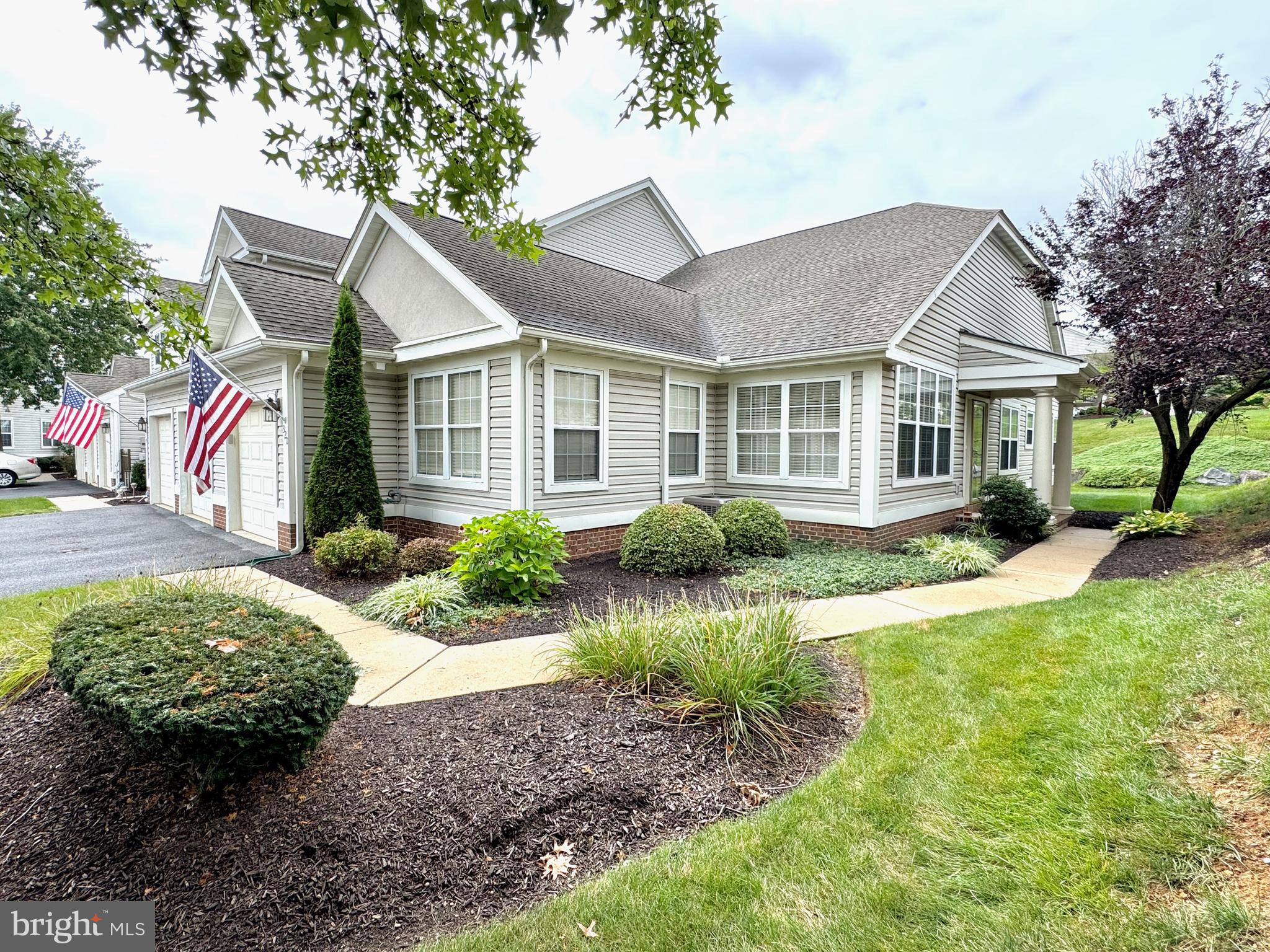 Welcome to Oak Hill at Spring Ridge! This one floor living, end of row, well-maintained townhome is just what you've been looking for! Nestled within Spring Twp and the Wilson School District, it doesn't get much better than this! Step into the front entry and be welcomed by the open living space. The spacious open floor concept allows you to take in the dining room, foyer and living room, immediately as soon as you walk in the front door. The architectural columns, vaulted ceilings, and laminate wood floors are the perfect touch! The gas fireplace tucked in the corner makes for a cozy living space on those cool fall evenings. The large kitchen space consists of a wrap around kitchen, with corner sink, built in microwave, gas cooktop, wall oven, and lots of countertop and cabinet space! The area is more than spacious enough to add a future kitchen island. A second dining area or living space can also be found right off the kitchen, and soaks in all the evening sun. A sliding glass door leads to a relaxing back patio area. This home offers two bedrooms, including a spacious primary bedroom, with vaulted ceilings, an on-suite primary bath, and two closets! Two full bathrooms and a laundry space and mechanical mechanical room round out the interior of the home. The home is equipped with an updated gas furnace, gas water heater, water softener, and central air unit! Some accessibility and mobility features can be found throughout the home. A one car attached garage, driveway, and additional parking spots can be found around the Oak Hill Ln cul-de-sac. The HOA makes for easy living, and takes care of all of the grounds, common areas, lawn, recreation facility, snow removal, and trash. The charming community of Oak Hill offers great amenities and is located close to all major highways, shopping, and dining. This is a wonderfully cherished, well-maintained, and move-in ready townhome. Call us today to schedule your appointment!
