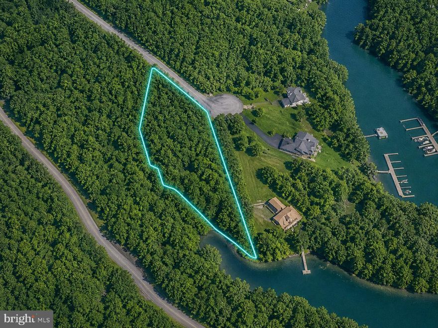 Nestled in the serene community of Runaway Bay, this stunning 1.09-acre parcel of land offers an exceptional opportunity to create your dream retreat. With breathtaking panoramic views of Leesville Lake, this property is a true gem for those seeking tranquility and natural beauty. Imagine waking up to the gentle sounds of a nearby creek and the shimmering reflections of the lake, all while being surrounded by lush greenery. Runaway Bay is more than just a location; it's a vibrant community that embraces the joys of lakeside living. Residents enjoy access to a variety of amenities, including well-maintained common grounds, a picnic area perfect for gatherings, and a private dock site for leisurely days spent on the water. Whether you're fishing, kayaking, or simply soaking in the sun, the waterfront features of this property enhance the lifestyle that comes with living in this picturesque neighborhood. The community is thoughtfully designed to foster connections among neighbors, making it an ideal place to build lasting relationships. With a strong sense of camaraderie, residents often come together for community events and activities, creating a warm and inviting atmosphere that feels like home. For those who appreciate the outdoors, the surrounding area boasts numerous parks and recreational opportunities. Enjoy hiking trails, nature walks, and scenic spots perfect for picnics or simply unwinding in the beauty of nature. The local parks provide ample space for outdoor activities, ensuring that there's always something to do just a stone's throw away. Education is a priority in this community, with access to quality schools that are dedicated to fostering a supportive learning environment. Convenient public services and amenities are also within reach, ensuring that daily needs are met with ease. From shopping and dining options to healthcare facilities, everything you need is just a short drive away. This property is not just a piece of land; it's an invitation to embrace a lifestyle filled with adventure, community, and the beauty of nature. With its stunning views, prime location, and the warmth of the Runaway Bay community, this is the perfect canvas for your future home. Don't miss the chance to make this idyllic setting your own!