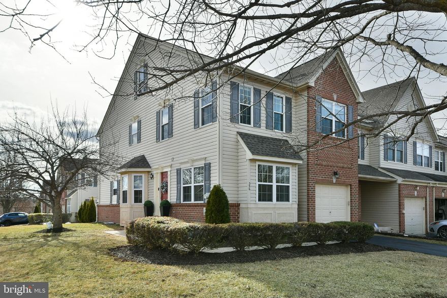 Experience the perfect blend of elegance and comfort in this exceptional end-unit townhome in the desirable Belcourt Manor Community, located on a peaceful cul-de-sac. Bathed in natural light, this well-maintained home is move-in ready, ideal for relaxation and entertainment. Step inside to a welcoming open floor plan that effortlessly connects the living, dining, and family rooms. The living area impresses with its stylish accent wall, while the two-story family room soars with upper-level windows, bathing the space in sunlight. A gas fireplace with a marble surround adds warmth and charm, making it the ideal spot to unwind. The centerpiece of the main level is the stunning renovated kitchen, showcasing granite countertops, stainless steel appliances, and ample cabinetry. The kitchen seamlessly extends to the private deck, perfect for hosting outdoor gatherings or simply enjoying serene green views. Rich hardwood floors throughout the first floor add a touch of sophistication, enhanced by a crystal chandelier in the dining area that radiates elegance. Fine millwork, exquisite trim and moldings in the first floor, and upgraded recessed lighting throughout all three floors provides luxurious ambiance.Ascend the elegant wooden staircase to the second level, featuring generously sized bedrooms. The master bath offers a cathedral ceiling, walk-in closet, and a luxurious soaking tub for ultimate relaxation, complemented by a convenient hall bath and laundry room. The finished third-floor loft serves as a versatile space for a home office, playroom, or fourth bedroom.The unfinished basement serves as a home gym and game area with durable flooring and customization potential. Recent upgrades, including a new roof, water heater, windows, and a fully renovated kitchen, enhance modern living and provide peace of mind.

A one-car garage and a driveway for two more vehicles provide ample parking. Enjoy expansive green views from the back deck and the prime location just minutes from the Lansdale Turnpike exit, shopping centers, and access to Harleysville walking trails, perfect for a healthy lifestyle.

1. "Modern Kitchen and  Expansive Granite Island"
2. Sun filled Bright & Open Layout"
3. Feels Like a Single Family Home
4. Smart Technology

Don’t let this opportunity pass by—schedule your showing today and make this spectacular house your new home!