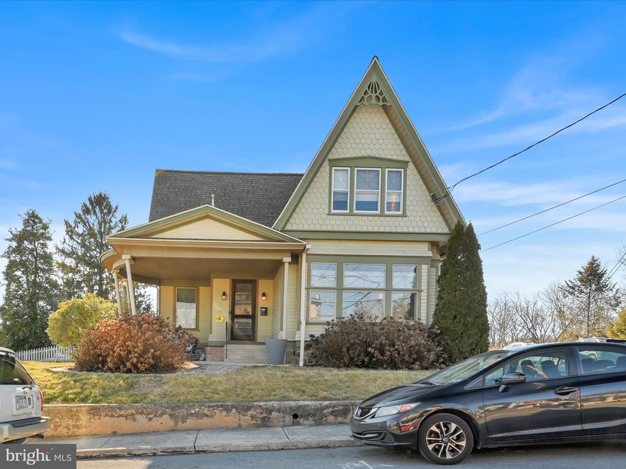 Welcome to 258 N. Poplar Street, a 1910 Victorian home, where timeless charm meets modern amenities.  With nearly 3,500 square feet of living space, this 4-bedroom, 2-bath beauty offers both character and countless possibilities.  As you step inside, you are greeted by a spacious foyer that leads into the beautiful dining room, complete with a striking gas fireplace.  This inviting space sets the stage for memorable family dinners and festive holiday gatherings. Hardwood floors throughout complement the vintage charm of the home, while the modern touches, including central A/C, gas heat, newer windows, plank siding, refinished driveways, fully replaced plumbing and wiring, offer all the comfort and convenience you need. The spacious living room is perfect for relaxing evenings or entertaining guests, while the gourmet kitchen is an entertainer's dream with cherry cabinetry, a duel-fuel 6-burner range, stainless steel appliances, and a convenient mini fridge for beverages and snacks. The kitchen flows effortlessly into the  sunroom (all new windows), where you can unwind with a gas stove and views of the backyard.  Also on the main level, is a spacious bedroom with an adjoining office that could easily be transformed into a sitting room or a stunning two-room bedroom suite.  Convenience meets functionality with the laundry room, now thoughtfully relocated to the first floor.  No more trips to the basement  - this practical space makes everyday chores a breeze.  Upstairs, there are three generous-sized bedrooms, one of which is a walk-through room, currently used as a sitting/TV room. The renovated bathroom and ample storage space upstairs add to the home's appeal.  Step outside to discover a true oasis—a beautiful built-in swimming pool and expansive backyard, offering the perfect space for entertaining or relaxing in privacy.  But the surprises don’t end there—the 2-story barn/detached garage has been revamped and is truly incredible! The first floor features a full bathroom, so guests enjoying the pool never need to enter the main house.  There is plenty of room for two cars and tons of storage on the first floor.  Upstairs, the 800-square foot space has been finished with a kitchenette, bedroom, and a split unit for heating and cooling, making it an ideal guest suite or even a potential Airbnb. (Please check with the boro for any necessary requirements.)  This one-of-a-kind home is not only a rare find but also boasts a prime location. It's just a short walk from a charming town and offers easy access to Harrisburg, Hershey, Lancaster, and York—making it the perfect blend of peaceful living and proximity to major attractions.  With its unbeatable charm, endless potential, and modern upgrades, this home is truly something special. Don’t miss the opportunity to make it yours!