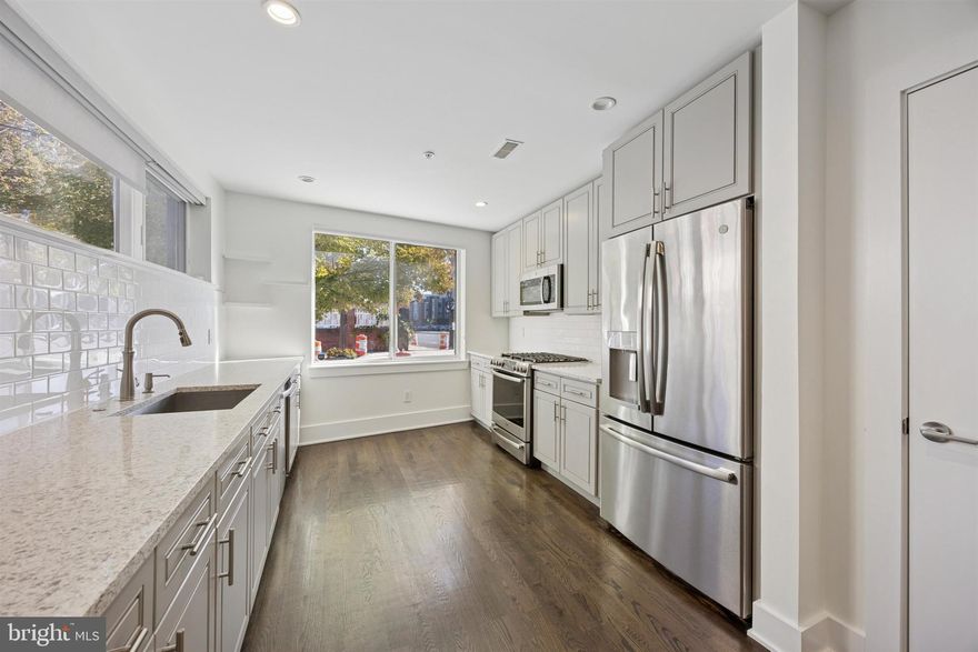 From the moment you arrive, you'll feel at home in this 2-bed, 2-bath condo. Walk into the common courtyard—look up to see the twinkling outdoor lights—and through your own private entrance. Upon entering, recessed lighting creates a light and airy ambiance with modern features and clean lines. Here, you'll find an intimate family area that's perfect for cozy nights in and movie nights. The straight-through style of the home allows for a small dining space before entering the open kitchen. There, cooking is a breeze thanks to stainless steel appliances, a gas oven/stove, and large sink that makes cleaning simple. Light grey cabinetry, white subway tile, and custom blinds throughout the home add a modern yet inviting style. The kitchen offers a pantry closet with custom built-ins and pull-out drawers.

Head downstairs to find the spacious bedrooms—both feature double door closets. High ceilings in these rooms also make them feel even larger. One bedroom features tray ceilings, as well. The bathrooms provide privacy for both bedrooms, one of which features a tub/shower while the other is a walk-in shower with marble-like tile backsplash. The new IKEA wardrobe is also included, if the buyer desires.

Located in Queen Village, street parking is decently accessible along the main streets, while permit parking is available on residential. Plenty of parks are nearby, as well, including Jefferson Square and the Shot Tower Recreation Center. Around the corner, find The Palm Tree Market, Philadelphia Java Company, For Pete's Sake, and Lucky's Last Chance. James Beard Award-nominated restaurant Royal Izakaya is also in the neighborhood—enjoy omakase, sushi, and traditional Japanese bites. For even more bites and shopping, South Street is only a 12-minute walk away. Broad Street and Spruce Street Harbor Park are also within a 10-minute drive. 

This home will go fast! Don't miss your chance to make it yours and schedule your tour today.
