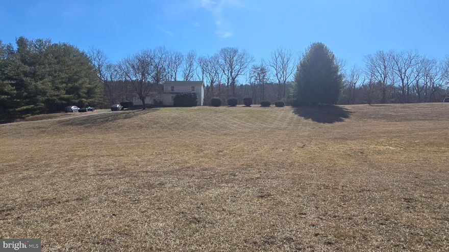 Situated  on 2.51 acres, this 4 bedrooms, 3 Bath home could be your forever home. This  country home is conveniently located approximately .1 miles off of Bloomery Pike in the quaint little community of  Slanesville WV . 

Walking inside you will find a nice size  living room with two ceiling fans, perfect for gatherings or just relaxing after a hard days work .  The kitchen has brand new LVP flooring and updated appliances, new faucets, and a brand new exterior French Door leading to the back yard. The walk in  pantry and a laundry room  are  also located on the main floor.  Do you need a Primary Bedroom and Bathroom on the Main Floor? Well your problem is solved. The Primary bedroom is tucked away with plenty of separation from the rest of the home. The large walk in shower is also a  plus. As you go upstairs, the 3 bedrooms and bathroom upstairs, will fit any size home you may need. The flooring in Bedrooms 3 and 4 does need floor covering. If that becomes an issue, it will be addressed. So get out of the city and own your little piece of West Virginia countryside, this house is located on an awesome, unrestricted lot. You can bring your chickens,  grow your garden or just enjoy an evening walk, the opportunities are  endless. This home also has a bonus room which could easily be a fifth bedroom if needed. It  is Fiber Optic ready through Frontier Internet. There is also a  shed if you need  extra storage space and a nice sized fenced in yard.

Check out the list of improvements that have been made:

Well pump was replaced in 2020
Washer was replaced in 2020
New gutters in 2022
New refrigerator in 2021
New stove and dishwasher in Dec 2024
HVAC system was pressure tested and recharged in 2023
HVAC compressor fan motor replaced in 2023 (upstairs unit)
HVAC starter capacitor replaced in 2023 (both)
Septic tank recently pumped in 2024
The Kitchen and Dining Room Floors were just replaced withLVP Flooring.
The back French door was completed replaced at the same time. 

There are still more updates and repairs to be done, but the opptunities are there to take this home from ok to amazing. There has been a lot of interest already on this home, don't miss your chance,   schedule your showing today.