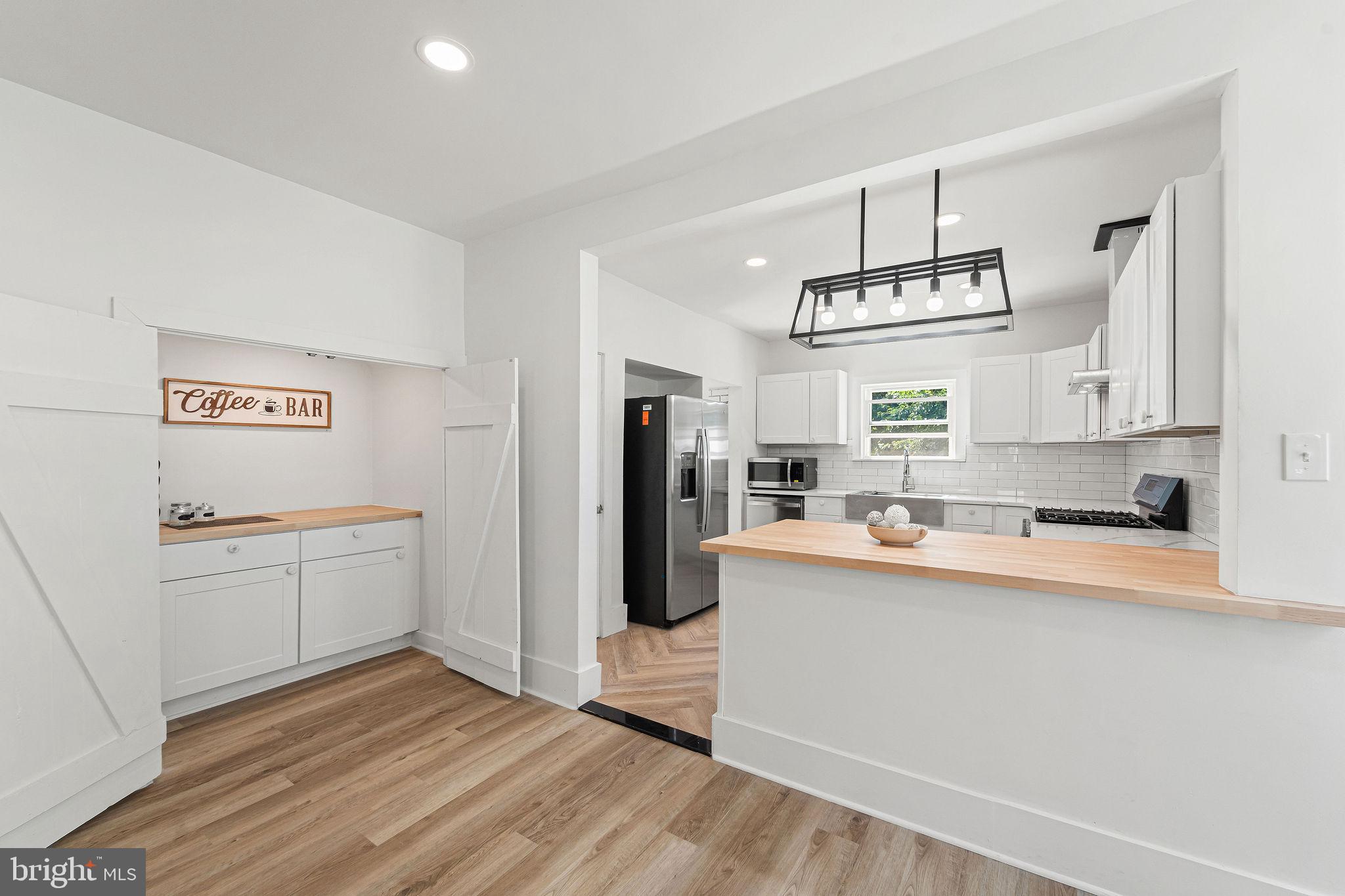 Nestled in the charming Drexel Manor neighborhood, this beautifully renovated twin home, originally built in 1926, is set to shine with major updates in 2025. With its traditional Tudor architectural style and inviting stucco exterior, this residence exudes warmth and character. Step inside to discover a spacious layout featuring four cozy bedrooms and two full bathrooms, perfect for both relaxation and entertaining. The heart of the home boasts a delightful fireplace, creating a welcoming ambiance for gatherings. The basement offers additional space for storage or creative projects, while the detached garage and driveway provide convenient parking options. Drexel Manor is not just about the home; it's about the community. Enjoy the benefits of nearby parks, perfect for leisurely strolls or weekend picnics. The neighborhood is known for its friendly atmosphere and vibrant community spirit, making it an ideal place to connect with neighbors. Local schools are within easy reach, ensuring quality education for all ages. Public services are readily accessible, enhancing the convenience of daily life. With a blend of historic charm and modern updates, this home is a true gem in a community that values comfort and connection. Experience the joy of living in a place where every detail has been thoughtfully considered, making it not just a house, but a place to call home.