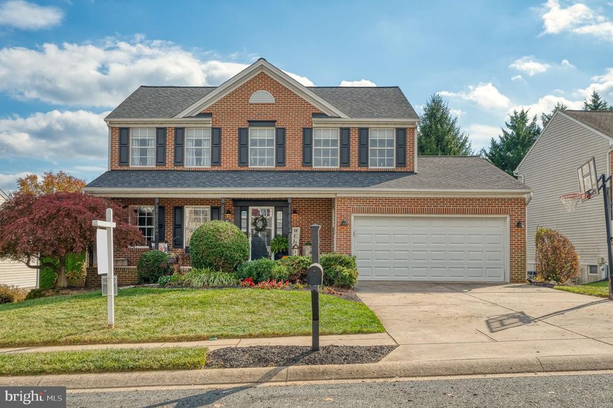 Welcome to 407 Cub Hunting Court, located in the sought after school district of Ring Factory Elementary and Patterson Mill Middle and High Schools. This timeless  brick colonial is situated in a peaceful cul-de-sac with a welcoming front porch that leads you inside to an inviting two-story foyer with new hardwood flooring. You'll find living and dining rooms with moldings and neutral walls. The eat-in kitchen with 42-inch maple cabinets, stainless steel appliances, and granite countertops/island is both functional and stylish, perfect for cooking and gathering. The open design connects the kitchen with the family room, which features a gas fireplace with a stacked stone surround—a warm and cozy space for relaxation. A sunroom with a cathedral ceiling and access to a large maintenance-free deck and has walk-down stairs, leading to a spacious patio with hot tub (excluded) and TV. Upstairs, the primary bedroom has a vaulted ceiling, walk-in closet and attached full bathroom with double sink, jacuzzi tub and separate shower. There are three additional bedrooms along with another full bathroom in the hall. The newly carpeted, fully finished, and spacious walk-out basement includes a wet bar, full bathroom, rec room with surround sound wiring, and a bonus room that can serve as an office or extra bedroom. You'll exit the basement to a leveled and fenced rear yard. The laundry is situated on the main level for added convenience and there is a two-car garage with ample storage space.