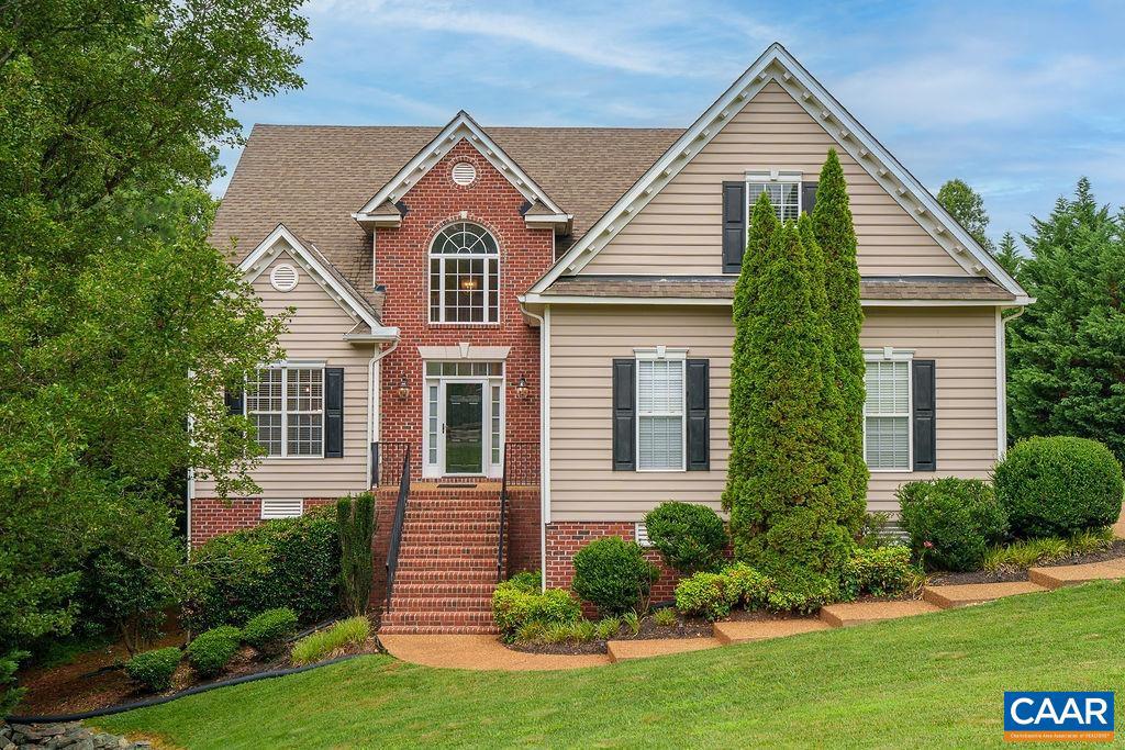 This impeccably maintained home is well-situated near all of the amenities of Spring Creek. The main level features a large living room, two dining areas, kitchen, half bath, laundry, and primary suite with full bathroom and 2 walk-in closets. Upstairs are three more bedrooms and a full bathroom. The basement offers additional entertaining space with a large family room, rec room, and an additional fifth bedroom with full bathroom. Kitchen includes granite, induction cooktop, and wall oven. Backyard features a deck perfect for grilling and a patio off the basement family room. Tasteful perennials and an irrigation system provide for colorful and low-maintenance enjoyment. Expansive storage options in basement utility room and in the oversized garage. Gated community includes nationally-ranked golf course, clubhouse with restaurant, fitness center, 25-meter pool, tennis & basketball courts, walking trails and playground. 20 minutes to Charlottesville and less than an hour to Richmond.,Granite Counter,Fireplace in Living Room