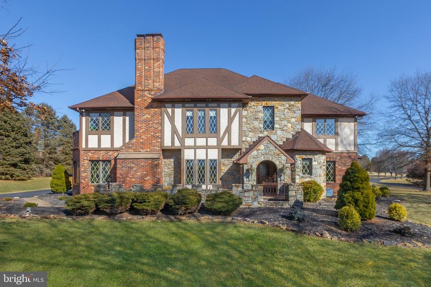 Tudor home in sought after Woodsbrook in Fallston. Beautifully maintained home sitting on 2+ acres on cul-de-sac, 5 bedroom 3.5 baths with 3 car garage.  Full of amenities: hardwood floors, exquisite millwork, 3 stone fireplaces, gourmet kitchen with island and wet bar, first floor office, paver patio in back, primary bedroom with ensuite bath and walk-in closet, 4 additional bedrooms on upper level and 2 full size bathrooms, second floor laundry and finished basement with walk-up to backyard. Magnificent views from every room.