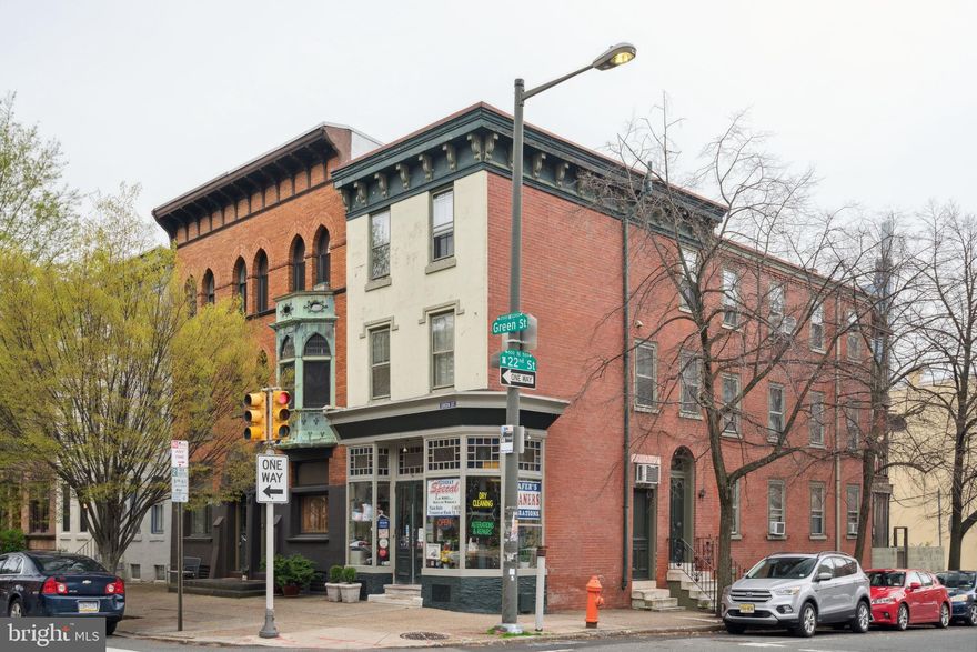 A remarkable investment opportunity on one of Fairmount’s most coveted blocks. Welcome to 2148 Green! This marvelous corner property, an income-producing quadplex, features one commercial unit and three bright and airy residential units. Perched on the corner of 22nd and Green, the charming commercial unit is perfect for a small business or office space. The three residential units are accessed through a separate entrance on 22nd Street. Each unit is flooded with natural light and boasts an open layout and outdoor space. On the first floor, the spacious studio apartment centers on an original decorative marble fireplace and adjoins a private backyard garden with street access. Both upper level units offer their own unique charm and feature spacious open plan living areas and decks that overlook the city. Whether you're a seasoned investor or looking for your first investment property, this quadplex offers an exceptional opportunity to own a piece of one of Philadelphia's most desirable neighborhoods. Don't miss your chance to own this incredible property and start generating passive income today.