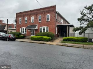 Industrial / Commercial Building 26,000 SQ.FT. This well maintained three floor Manufacturing Building, has a second parcel containing a paved parking lot located in the Commercial District of Laureldale Borough. Owner occupant or Investment potential with the right tenant. Rental income on the building in 2023 was $111,685 where the tenant paid all utilities, insurance and repairs except roof. Rental income on second parking lot parcel for 2023 was $4360. Main floor consists of offices, lab, employee lunchroom and warehouse space with 2 Loading docks. Second level has more offices, employee locker room and additional warehouse space. Lower level is the manufacturing floor with drive out door to the fenced-in yard. The second parcel has over 24 parking spaces.
Easy Access to Rt.222, Rt.12, and Rt.61