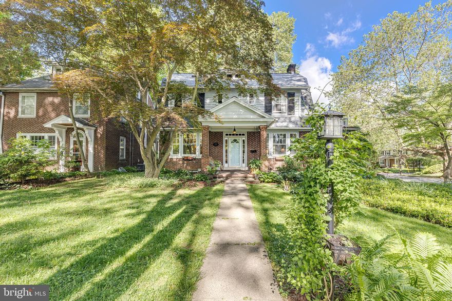 WELCOME HOME to this stunning  four-square colonial home loaded with charming original features and local history, complimented with updated mechanicals and modern amenities! Beautiful hardwood floors with accent in-lays, tall ceilings, wood fireplace, 1st floor study/library, formal dining room and fully remodeled kitchen with soapstone counters, island with seating, and stainless appliances. Second floor boasts 4 bedrooms and a remodeled full bath, plus enclosed porch sitting area - perfect spot for your morning coffee! Third floor has newly remodeled full bath, skylights, 5th bedroom and attic storage. The rear deck and patio area provide the perfect setting for outdoor living space. A highly sought after 2 car garage provides worry-free parking. Newer high efficiency gas boiler with instant hot water and central air, newer roof and gutters, fresh exterior painting, upgraded electric, and radon mitigation system - MUST SEE! (See full list of updates in document section.)