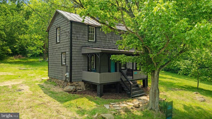 **OFFER DEADLINE SET FOR SUNDAY, JUNE 22ND, AT 6:00PM** Welcome to 2245 Buck Mountain Rd — a beautifully restored 1900-built cabin nestled on over 3 peaceful acres. This historic home has been thoughtfully updated throughout, including all-new mini-splits for A/C and heat, kitchen, bathrooms, and luxury vinyl plank flooring.

Enjoy your morning coffee on the spacious front porch while taking in the serene mountain surroundings. Inside, the main level offers a light-filled living room, a brand new kitchen with stainless steel appliances, updated countertops, and new cabinetry, plus a convenient powder room and stacked washer/dryer.

Upstairs features two comfortable bedrooms and a fully renovated full bathroom. The property also includes a separate art studio with electricity—ideal for a creative workspace or workshop—as well as a chicken coop, rustic dog house, and additional storage building further down the driveway.

Located just 15 minutes from Skyline Drive, Shenandoah National Park, and downtown Front Royal, this mountain retreat offers the perfect blend of privacy and convenience. Don’t miss your chance to own this one-of-a-kind cabin—schedule your showing today!