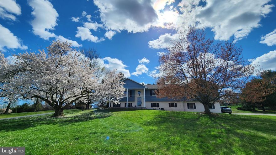 This beautiful house is country living at its finest! The property is on a large 1.03 acre lot near Route 15 for easy commuting to York/Harrisburg/Mechanicsburg or northern Maryland. This 4 (possibly 5) bedroom, 3 full bathroom home is nestled within Northern York School District.
The spacious, newly renovated kitchen with stunning quartz countertops and a single basin sink will delight anyone who loves to cook. A large peninsula serves as both a breakfast bar and sprawling countertop. The main floor includes 4 bedrooms and 2 full bathrooms. The living room is adorned with hardwood flooring and a picture window overlooking the front yard.
The palatial owners suite features vaulted ceilings, a full bathroom, and a separate dressing area with a second sink. It also features a large walk-in closet and direct access to the deck and inground pool.
The lower level features a family room with a pool table and pellet stove, and is currently used as an office/gaming room. There is a dedicated laundry room including a third full bathroom. A movie theater room rounds out the lower level, which could serve as a fifth bedroom. Between the media room and the garage is a large storage room with built-in shelving - great for organization! The large two-car garage is big enough for a workbench area and includes two 240V charging outlets for electric vehicles.
The big yard will delight any homeowner who would love to add a chicken coop, garden, greenhouse, and more. Multiple mature trees around the property offer extra privacy and serenity. When the temperatures start rising, play a game of basketball in the driveway before jumping into the large inground pool, complete with a diving board and a bonus basketball net! A screened-in porch next to the pool is a great option for entertaining guests.
The sellers plan to leave all of the appliances including a Speed Queen washer and dryer and a whisper-quiet Bosch dishwasher that were all purchased in November. Don't miss out on the opportunity to own this wonderful home!