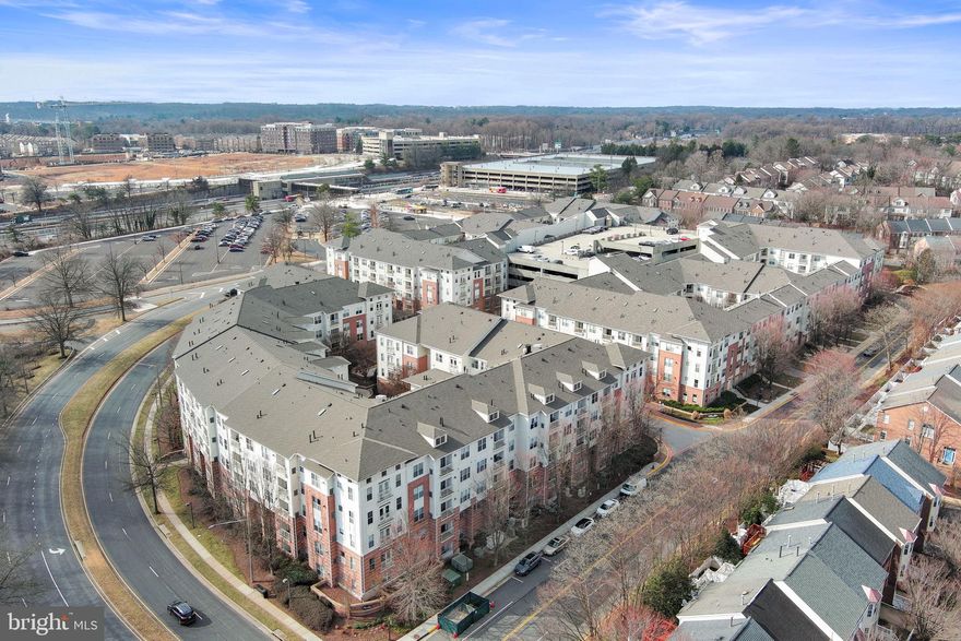 This beautifully updated and meticulously maintained 1-bedroom, 1-bathroom condo is located in the desirable Acadia at Vienna Metro Station. Situated on the ground floor, the unit offers convenient access to the indoor garage, management office, clubhouse, and exit lobbies directly across from the Metro entrance.

The kitchen boasts ample cabinetry, and a cozy breakfast bar. The spacious living/dining area features large windows filling the space with natural light. A dedicated home office nook with a built-in desk provides a perfect spot for remote work.  The large bedroom includes a generously sized walk-in closet. The unit also features fresh paint and new carpet throughout. The laundry area comes equipped with a washer/dryer and recently serviced HVAC system.  An assigned indoor garage space is located one level below, with nearby access to both the elevator and stairs. Ample visitor parking is available in the garage and on the street with permit.  Acadia’s resort-style amenities include a clubhouse, business center, fitness room, indoor basketball court, cinema room, golf simulator, and a game room complete with a billiards table, shuffleboard, and tables for cards or board games. Outdoor features include a swimming pool, landscaped courtyards, and more.  Perfectly located with easy access to I-66, Routes 50, 29, and 495. Just steps from the Vienna Metro and minutes to the Town of Vienna shopping center, featuring numerous restaurants and grocery stores. Mosaic District and Tysons Corner are only a 10-minute drive away.  Don't miss the opportunity to call this home!!