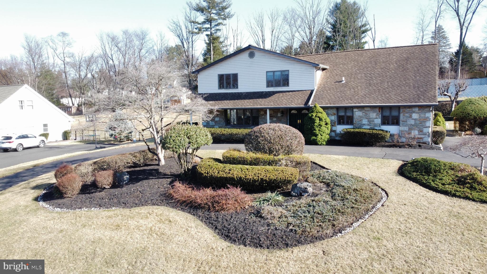 Offer Deadline - Sunday at 6pm. Stately Justa Farms Colonial with Pool. Nestled in the sought-after Justa Farms neighborhood, this impressive Colonial home is on the market for the first time in half a century! Offering timeless charm and modern convenience, this spacious 5-bedroom, 3 full and 2 half-bath home is ready for its next chapter. Step into the inviting foyer, where turned stairs and vaulted ceilings set the tone for this grand residence. To the left, a formal living room and dining room provide elegant entertaining spaces, while the heart of the home lies straight ahead in the eat-in kitchen. At the back of the house, a cozy family room features a striking stone wood-burning fireplace and sliding doors leading to a covered patio—perfect for indoor-outdoor living. The first floor is designed for flexibility, featuring a laundry room, a home office (which can easily serve as a sixth bedroom with its own closet), and a true first-floor bedroom complete with an en-suite bath and walk-in closet. A convenient half bath completes this level. Upstairs, four generously sized bedrooms offer ample space, with two full baths that have been tastefully updated over the years. Storage is abundant, including two bedrooms with walk-in closets. The finished basement is a standout feature, boasting a retro bar area with a working sink, a wood-burning fireplace, a walk-in cedar closet, and an additional half bath—ideal for entertaining or creating a cozy retreat. Outside, the unique features continue with a large circular driveway, a partially heated section for added convenience, and a two-tiered backyard. The lower level provides a spacious play area, while steps lead up to a fenced-in pool area. Though the pool’s internal components and pool house were removed a few years ago, utilities remain in place for future possibilities. This home is being sold in as-is condition, reflected in the listing price, presenting an incredible opportunity to add your personal touch to this classic beauty. Don’t miss your chance to own a piece of Justa Farms history—schedule your showing today!