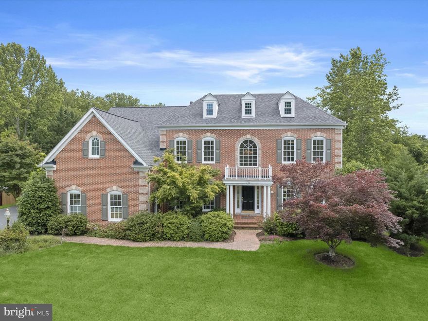 Exceptional Brick-Front Colonial in Gambrills. 
Nestled at the end of a quiet cul-de-sac on a premier flat grassy 0.84-acre lot in Saint Stephens Estates, this stunning 5,000+ sq ft home combines timeless elegance with modern luxury. Featuring a fully renovated chef’s kitchen with professional Thermador appliances, sunlit morning room, expansive family room, 10 ft ceilings and custom millwork in main and second levels, and a grand two-story foyer, it’s perfect for both everyday living and entertaining. The luxurious primary suite offers a sitting room, dual walk-in closets, and a new marble spa-like bath, complemented by three additional bedrooms and a finished lower level with a kitchenette, gym, bedroom and bath with separate entrance. Recent upgrades include a new roof, new fence, newly remodeled kitchen and two new marble baths, refinished deck, paver patio with hot tub, fire pit, pergola, wide-plank French white oak floors, and designer lighting throughout. Just moments from Waugh Chapel Towne Centre and major commuter routes, this home is a rare and remarkable offering in Gambrills.