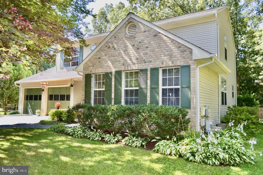 Welcome Home to this Beautiful Updated 4 Bedroom, 2 Full Bath & 2 Half Baths Plus 2 Car Garage Colonial in the Sought After Water Privileged Community of Stewarts Landing.  Perfectly Sited on a Private Lot thats on a cul-de-sac with 2100 sq ft of Living Space (above grade) and Gorgeous Mature Landscaping with Front Porch Charm.  The Home has Many Thoughtful Updates Throughout to Include:  Roof (50 year), Kitchen, Baths, Paint, Fence, Front Porch & Back Patio & So Much More... The Main Level Presents:  Large Eat In Kitchen w/ Breakfast Bar, Granite, Pantry and Room for Your Table,  Separate Dining Room w/ Hardwood Floors, Living Room w/ Wood Burning Fireplace & Family Room for Relaxing. Lower Level Boasts: Club Room, Half Bath and Workshop Area.  Upper Level: Has Master Suite and 3 Additional Bedrooms w/ Nice Size Closets and Full Hallway Bath. This Water Privileged Community includes a Marina w/ Boat Slips, Launch Ramp, Kayak Storage, Playground, Basketball Court, Walking Paths and Many Seasonal Community Events and Activities Throughout the Year, Located in the Heart of Severna Park Blue Ribbon School District. Convenient To Shopping, Restaurants, BWI, Fort Meade, Annapolis, Baltimore and Washington, DC. This is a Special Neighborhood For Sure! Quick Occupancy Too!