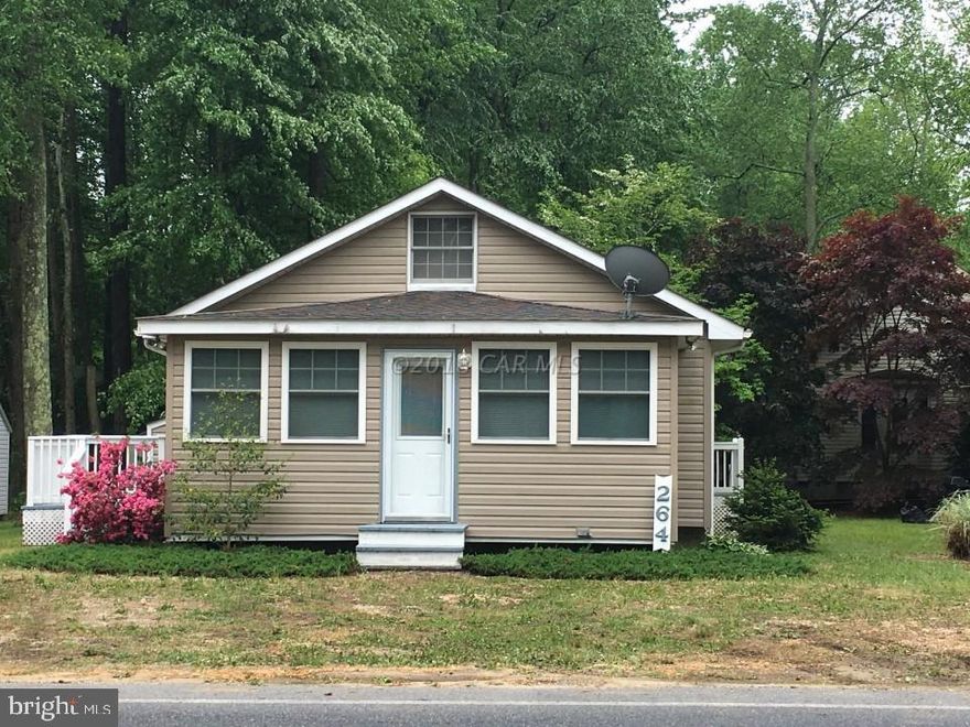 Affordable Coastal Style Beach House on cleared lot is ready for Summer Fun in Sun! Roof replaced a couple months ago and HVAC System is 5 yrs. Insulated Sunporch addition adds extra living area. Convenient walk to the Community Center and White Horse Park and close to North Side Pool and Tennis.