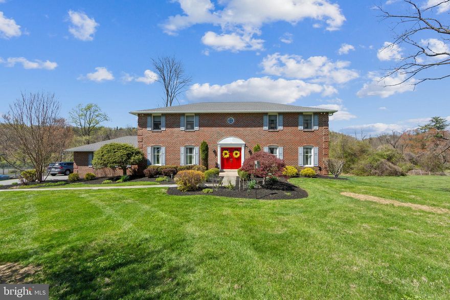 Nestled on a serene cul-de-sac amid a collection of distinctive homes, this bright
and spacious brick colonial rests on over an acre of beautifully landscaped
grounds. A stone path leads from the side driveway to a striking double-door entry.
Inside, a light-filled two-story foyer with open staircase sets the tone for the
welcoming interiors to follow. Just off the foyer, the formal dining room features
hardwood floors, elegant chair rail and crown molding—perfect for hosting
gatherings in style. Steps away you’ll find a freshly painted eat-in kitchen with
solid cherry wood cabinetry, center island and large above-sink window framing
the sweeping backyard vistas. The kitchen also offers direct access to the attached
two-car garage. Down the hall, a sunny home office and cozy family room await,
complete with wood-burning fireplace, built-in log storage and glass sliders that
lead to a spacious rear porch. A front living room and powder room complete this
luminous first floor. Upstairs you’ll find four bedrooms, including a tranquil
primary suite with ensuite full bath and walk-in closet. One of the remaining
bedrooms boasts an ensuite bath, while the other two share a full hallway bath. A
laundry room with utility sink is a practical, much-appreciated addition. The
finished, walk-out lower level offers versatile square footage for entertaining and
relaxing with space for a home gym or office. Glass sliders open to a newly
installed stone patio that overlooks one of the home’s most breathtaking features: a
wide, flat stretch of greenspace bordered by scenic woodlands and views of Gulph
Creek. Life in this Wayne hamlet offers the best of both worlds—easy proximity to
Radnor shopping, dining and conveniences paired with Upper Merion’s lower tax
rate. Close to major commuter routes, regional rail, Stoneleigh and King of Prussia too!