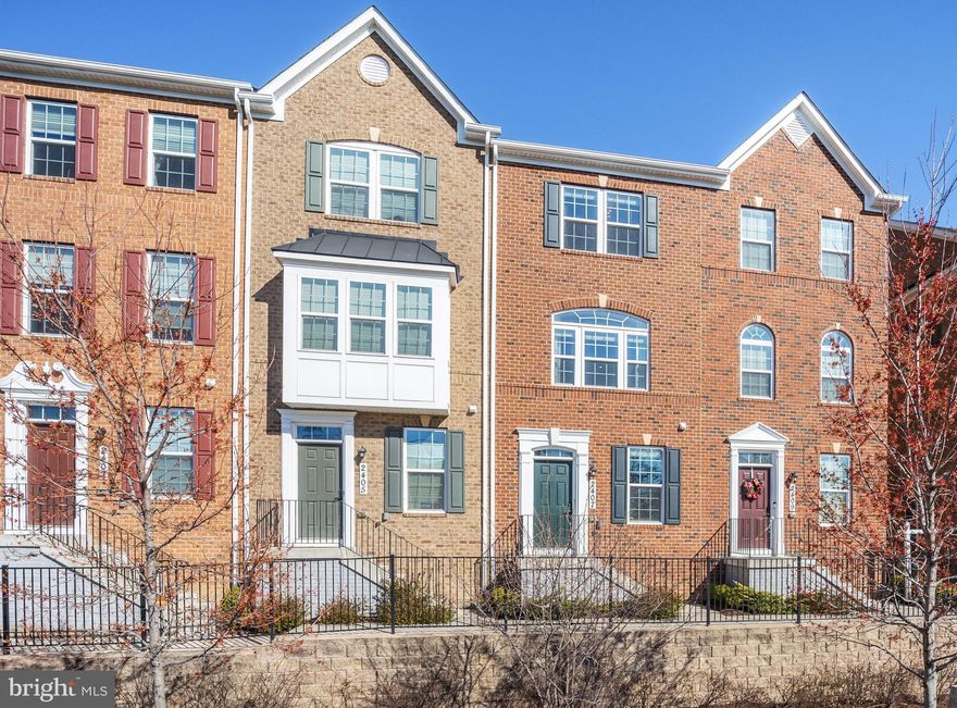 Welcome to your dream home! Rarely available and located in the highly sought-after Avondale community, this stunning 2-bed, 2.5-bath brick-front townhome is a must-see. Built in 2019, this home boasts over 1900 sq ft of living space across 3 levels and has been exceptionally well-maintained. As you step inside, you'll be greeted by ample natural light and trendy finishes throughout. The spacious entry-level rec room with garage access and powder room offers the perfect space for an in-home office, kids' play area, or formal living room. Upstairs, the welcoming main level features recessed lighting, gleaming luxury vinyl plank floors, and large windows that bathe the space in natural light. The Chef’s kitchen is a standout feature, with beautiful white cabinetry, granite countertops, a classic subway-tiled backsplash, stainless steel appliances, and a spacious island, perfect for meal prepping. Enjoy your morning coffee on the breakfast bar or step out onto the rear balcony to take in some fresh air. The open layout dining and large living area make this home perfect for hosting game nights or movie nights in. When ready to unwind, head upstairs to the owner's suite with two large closets, modern chandelier, custom paint, and en-suite bath featuring a tiled stand-up shower and dual sink vanity. The second bedroom suite and full bath are perfectly situated on the opposite end of the hall for added privacy. This home also includes a laundry closet with stacked LG washer/dryer and one car garage plus driveway that offers off-street parking for up to two cars. Enjoy low-maintenance living and community amenities, including a pool, tot lot, and local park access just steps away. Conveniently located within 1.5 miles to West Hyattsville Metro station (green line), with easy access to Rt.500 for a breezy commute, and just 4 blocks to the DC line, this home is a commuter's dream. Don’t miss this!