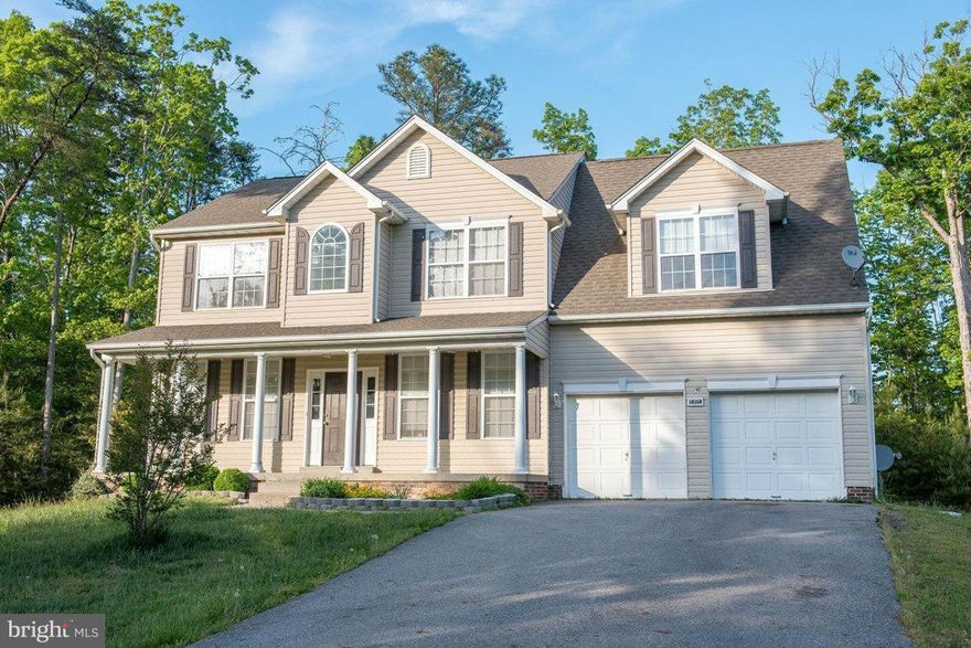 CLASSIC COLONIAL WITH WELCOMING FRONT PORCH FEATURES OPEN FLOOR PLAN & FULL FINISHED BASEMENT! SEPARATE DINING RM & LAUNDRY RM, LG KITCHEN OPENS TO BREAKFAST ROOM WHICH LEADS TO THE FAMILY ROOM. BACK STAIRCASE TO 2ND LEVEL, 4 BEDROOMS & 2 FULL BATHS. .92 ACRES W/MATURE TREES AND NO COVENANTS & RESTRICTIONS! BRING YOUR RV, 4 WHEELER & BOAT!  ****ONLY 10 MINUTES TO PAX RIVER OPPOSITE OF TRAFFIC!****