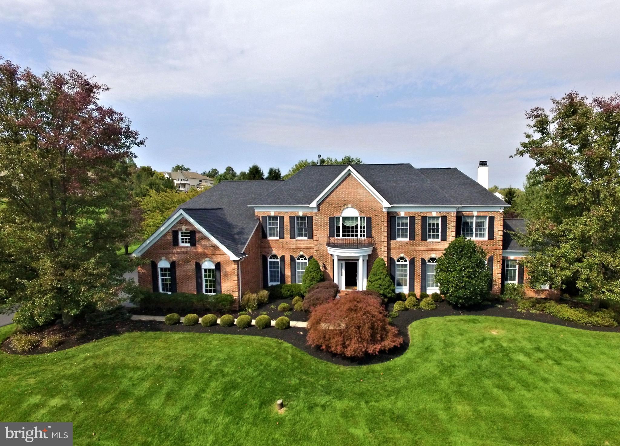 This absolutely stunning, spectacular, expanded classic for the ages brick front colonial in one of Upper Makefield's most prestigious and sought after communities, River Crossing, is now available for purchase. Sited beautifully on an impeccable 1.95 acre parcel, this spacious estate home is replete with high end custom features and finishes both inside and out. The property, set on a higher lot, features updated and gorgeous Kitchen and Primary Bath, 4/5 bedrooms, 4.5 baths, incredible back yard, finished lower level, and over 6,500 square feet of finished space, including TWO well appointed home offices, perfect for these imperfect times. Each spacious room is a seamless blend of neutral color, materials and light, and the property is in immaculate, mint, move - in condition, offered for the first time by its original owners. The soaring two story foyer welcomes you with gorgeous hardwood floors. Immediately you will notice the gleaming, impressive crown moldings and trim throughout. To the left is the elegant formal dining room, with coffered ceiling, wall sconces, transom windows and butler's pantry with Sub Zero beverage center. To the right is the formal living room with transom windows, and French Doors leading to a private office, also featuring transom windows. The spectacular gourmet kitchen features premium appliances such as a Wolf Six Burner Stove/Oven, Wolf Double Wall Oven/Convection Oven, Sub Zero 42" side by side Refrigerator/Freezer, 42" cabinets, tumbled stone backsplash, beautiful granite counters, multi-tiered center island, double sink w/ reverse osmosis tap, nicely sized walk in pantry, and convenient rear staircase. The adjoining two story breakfast room with picture window is the centerpiece of this space, with additional cabinet and serving space, opens to the Sun Room with its cathedral ceiling and walls of windows overlooking the patio and outdoor fireplace and rear yard. The family room, open to the kitchen, is single story with large picture window overlooking the rear yard, and features a wood burning brick surround fireplace with gleaming white mantel. The second home office is beyond the family room, with French doors, large built ins, cathedral ceiling and long distance views. An elegant powder room, mud room entry from the three car garage, and laundry room complete the main floor. The upper level features a bridge overlook to the foyer and breakfast room, luxurious Primary Suite with coffered ceiling, giant walk-in closet, and adjacent sitting room. The Primary Bath with jetted tub, marble floors, his and her vanities, and oversized shower is reminiscent of a high end spa. Bedroom 2 is price/princess suite, bedrooms 3 and 4 share a large Jack and Jill bath. All bedrooms are bright and airy, with custom walk in closets and recessed lights. The finished lower lever, with impressive trim work, features a large entertainment / theatre / game area with gorgeous built ins, wet bar serving area, flex room perfect for music, exercise, craft or 5th bedroom, as a well appointed full bath is adjacent. The outdoor space features mature trees, privacy, large patio, brick fireplace and more. Multiple zone zone Heat/AC, back up whole house generator, security system, lawn irrigation and many more recent upgrades and capital improvements too numerous to mention make this one of a kind offering in the Council Rock School District the best buy on the market today. Located in heart of Upper Makefield, just minutes from area parks, New Hope, Newtown, and bridges to New Jersey.***Showings start on Sunday, October 11 at the Open House 11am - 3pm.***