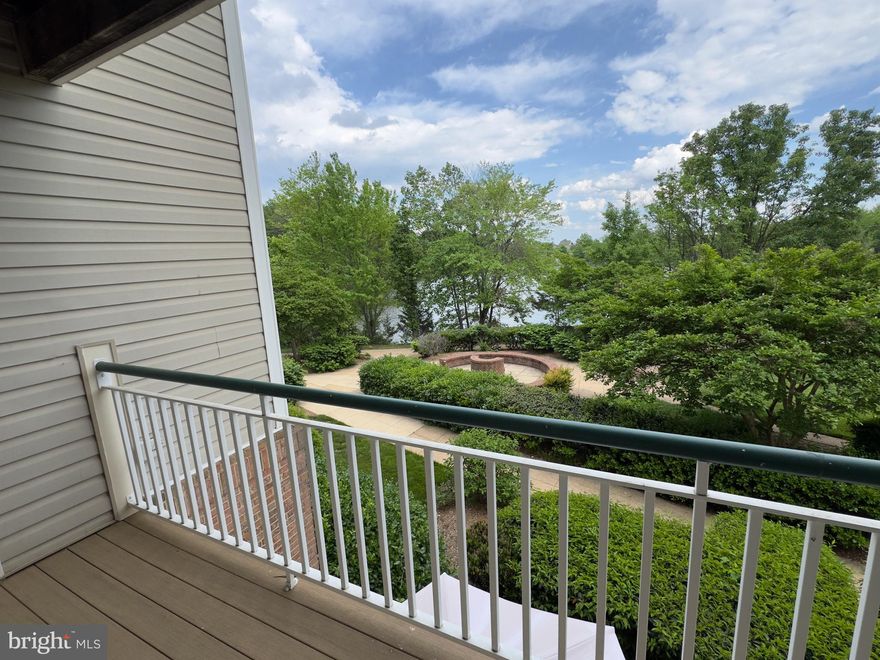 ADDITIONAL PHOTOS COMING!   Welcome to your dream Kingstowne condo! Best of all possibilities:  Entrance is on the ground level (no stairs!); balcony is a 2nd level balcony!   Charming 2-bedroom, 2-bathroom apartment, nestled in a serene community, offers a perfect blend of comfort and style. Built in 1996, this traditional unit features an inviting layout with 1,280 sq. ft. of excellent living space, adorned with engineered wood and ceramic tile flooring.  NO CARPET HERE!   The family room seamlessly connects to the kitchen, making it ideal for entertaining. Enjoy cozy evenings by the gas fireplace, or unwind in the luxurious primary bath with a soaking tub and walk-in shower. The kitchen is a chef's delight, equipped with granite, stainless steel appliances, including a built-in microwave, dishwasher, and gas range. Convenience is key with a stacked washer and dryer right in your unit. Step outside to discover extensive hardscaping, a gazebo just steps away, and a delightful brick patio area, perfect for outdoor gatherings. Enjoy breathtaking views of the lake, scenic vistas, and lush trees from your private balcony. The community amenities are second to none, featuring a clubhouse, fitness center, outdoor pool, and jogging paths, ensuring a vibrant lifestyle. With ample parking and security features for peace of mind, this property is not just a home; it's a lifestyle.  A+ walkability!  Ample restaurants, grocery and shopping within a 10 min walk.  Metro station only minutes away!  Don’t miss the chance to make this inviting space your own and experience the perfect blend of comfort, community, and natural beauty!