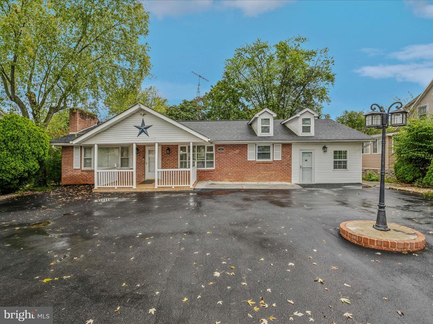 PRICE IMPROVEMENT.  There's a WHOLE LOTTA HOUSE here!   You will be amazed at the spaciousness of this house....not evident from the outside! Beautiful interior!
2BR/2BA, but three (3) additional flex rooms in the basement.  Also in the basement is a kitchen, full bath, and storage. This property also has COMMERCIAL POTENTIAL. Separate entrance to an area where you could have your business right from home! 
This is a CONVENIENT LOCATION near to major highways, Berkeley Medical Center, Foxcroft Avenue,
downtown Martinsburg and more. The fenced backyard is large with room , if you'd like, for a pool.