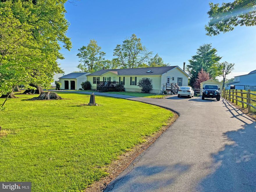 Fabulous Ranch Home with over 3,600 Sq. Ft. of Space!  Large 3 Bedroom and 2 Bath Home Ready for your Furniture.  Sited on a 1 Acre Lot and backing to a Farm.   Plenty of Counter Space in this Country Kitchen with Timeless Oak Cabinets and Island.  Sliders to the Jumbo Size Rear Yard.  Family Room off Kitchen with Wood Stove; Flagstone Hearth and Brick Surround.  Master Bedroom with Master Bath and 2 Person Whirlpool Tub and Separate Shower.  2 More Great size Bedrooms.  Second Family Room on Main Level.  Lower Level with 12" Block Walls and Exit to Rear Yard.  Lower Level has an Office or ? and Recreation Room.  AND still has approximately 800 Square Feet left for your Creativity.  Ark Roof approximately 6 years old; HVAC approximately 6 years old; Well Pump and Well Tank in 2023; and, MORE!  32 x 28 Detached Garage with Concrete Floor and Electric.  8 x 8 Shed.  30 x 12 Garage Shed.  Circular Drive.  Plenty of Room to Park your Toys and Plenty of Room to Work on your Toys!