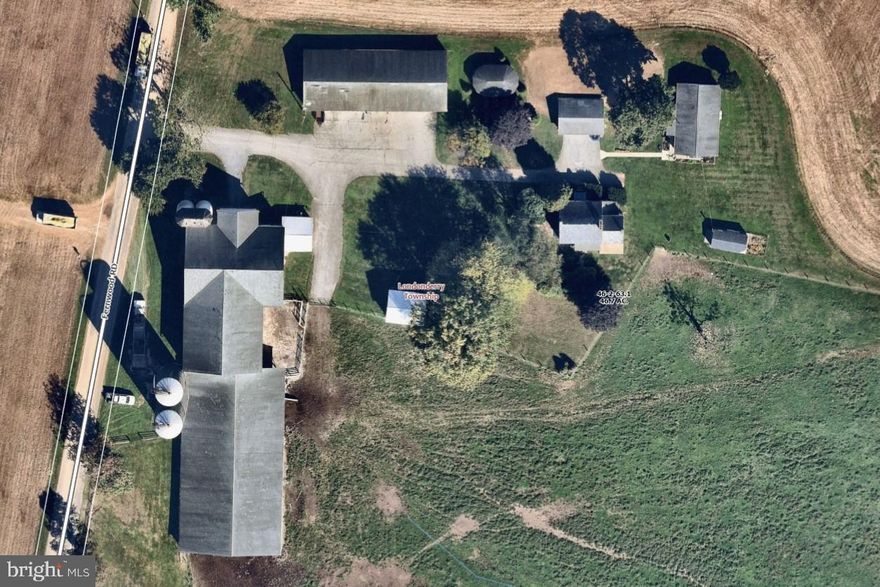 46.7 Acre Dairy/farm near Cochranville, PA. Farm has 2 houses, a 5-bedroom, 1/12 bath 2 story house including full basement with outside entrance and a 1 story 3-bedroom, 1 bath house. There is a 72-stall bank barn, 2-20'x70' metal silos and 2-12'x50' concrete stave silos, 130'x64' attached heifer barn, 100'x36 ' machine shed with corn cribs on both ends, detached drive through corn crib and detached three car garage. Property has 30 tillable acres of gently rolling farmland. 12 acres of meadows with 5 strand high tensile fencing, pond, stream and 11/4 acres of woodland. Property is leased for 2026. There is a Ag conservation easement with the Chester CO. Ag Preservation Board. Property is in Act 319 (clean and green)