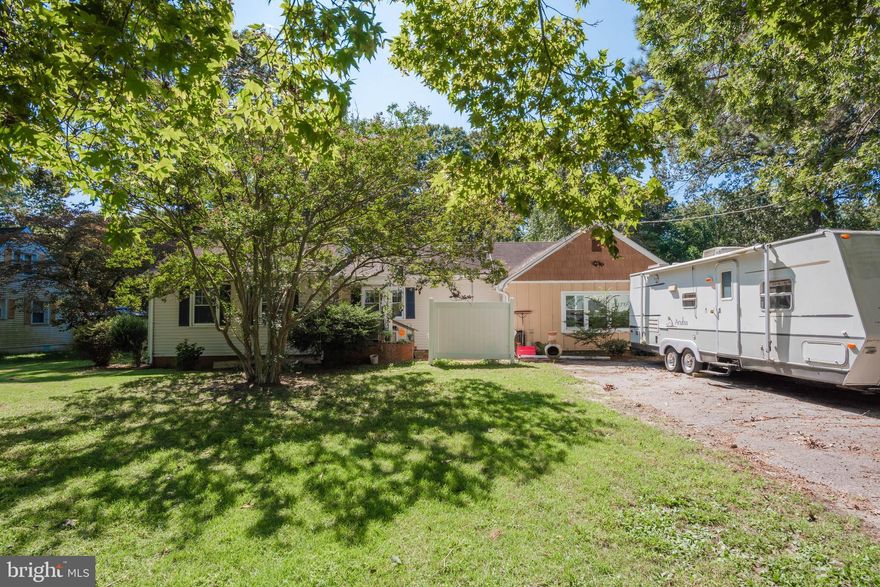 Sweet 2 bedroom, 2 bathroom home with no city taxes! Recent upgrades include replacement vinyl windows, new septic system (2015), solar panels, ceramic tile in kitchen and bath, new well pump, brand new ductless mini-split HVAC units (to be installed). This home also offers original hardwood floors in the living room  and both bedrooms that have been beautifully refinished.  There are also 2 sheds, one of which is setup as a workshop.  The large family room could easily become a 3rd bedroom with a full bath if a wall and closet were installed.