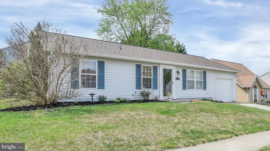 Welcome to Burnside. This is a beautiful and well cared-for home located in Hamstead, Maryland.  It sits on a corner lot, in a beautiful yard, atop a hill in the Small Crossings neighborhood in Carrol County. This quaint home offers a spacious front room living space as soon as you walk in the door.  There is a beautiful eat-in kitchen, with granite countertops and stainless-steel appliances, including a dishwasher. Both rooms have well-maintained laminate floors.  The large kitchen bay window and living room windows placed opposite one another brighten the freshly painted rooms with an impressive amount of sunlight.  There is one bathroom along the hallway and two carpeted bedrooms at the end of the hallway. This house has central air throughout.  The roof and gutters were updated just a few years ago. There is an attached garage with enough space for parking and storage. There is also a driveway and street parking available.  This home is just a short walk from the community’s distinguished and award-winning Main Street, with all its restaurants, shops, libraries, and great things to do throughout the year.  Its location is convenient for schools and public services.  It’s a stone’s throw away from play areas and parks like Lions Club Park and Leister’s Park. Check out Main Street’s accolades and activities on the town of Hamstead’s website. Though quiet and tucked away, this neighborhood is central to key highways and routes like 795, Falls Rd, and 83 making the commute to places like Baltimore, Westminster, Hunt Valley, and Owings Mills very convenient.  Likewise, the commutes to both Thurgood Marshall Airport (BWI) and to places in Pennsylvania are convenient too.  This is a great home in a community with historic charm.  Whether you are down-sizing, or just starting out, this might be the place for you.  Come and see for yourself.