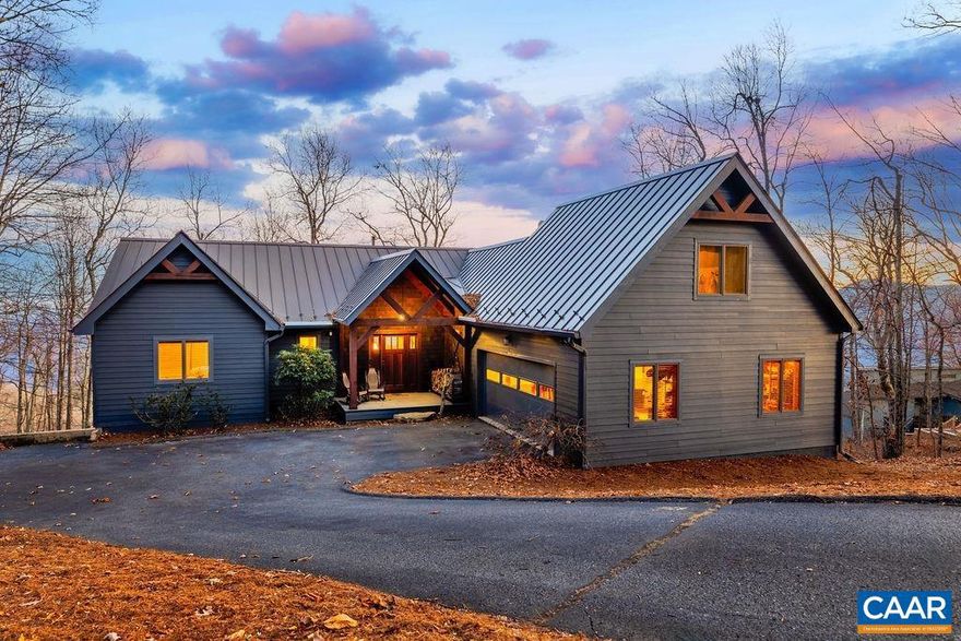 Once you enter this stunning mountain home you will know why you waited so long for the perfect one! Here rustic mountain charm meets high end elegance with dramatic year round views of the southern Blue Ridge Mountains. Thoughtfully, tastefully and with utmost quality the owners created by additions, renovations and handsome furnishings this like new turnkey home. The spectacular great room with post & beam design offers vaulted cedar ceilings, maple floors, stone wall, Jotul stove, and glass wall to the view. The new kitchen with state of the art appliances, custom cabinets and quartz counters will delight the cook and those who gather. The primary bedroom offers breathtaking views, vaulted ceiling and spa bath with steam shower and heated floor. The main level also includes a guest bedroom, new guest bath and powder room and large entry area. Downstairs a spacious family room with stone fireplace, pool table, wet bar, en suite bedroom with sitting area, custom built in bunk room, office, laundry and powder room, all leading out to expansive deck and hot tub. There is also a 2 car garage with 5th bedroom above. On a quiet cul de sac within walking distance to skiing and dining this beautiful Wintergreen home truly has it all!,Quartz Counter,Wood Cabinets,Fireplace in Family Room,Fireplace in Great Room