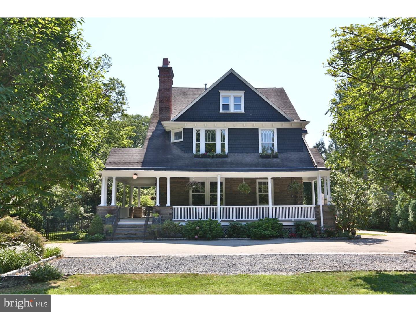 This is an absolutely gorgeous, fully renovated Victorian home on one of Chestnut Hill's nicest streets that is also one of Philadelphia's finest examples of colonial inspired "Shingle" style architecture. 6 bedrooms, 4 full baths and a lovely first floor half bath. The wrap around porch is a perfect respite from the hustle and bustle of a busy city life. The home is well proportioned with large interconnecting rooms that are not overwhelming and has central air, an elegant designer state-of-the-art kitchen with Carrera counter tops, a well-appointed family room directly adjacent to the kitchen and a comfy casual breakfast nook. The spacious rooms and halls have tall ceilings, original details, leaded glass windows and newly finished hardwood floors. On the second floor, there is a beautiful master suite, a regal second floor library/family room off the gracious second floor landing, two additional bedrooms and a lovely sun room. The third floor has two more bedrooms off another spacious landing, full bath, an office and a super functional laundry room. Current owners added major systems, re-wired entire house to modern standards, finished the entire basement, added a full bath in the basement, created an exercise room and built a gorgeous custom wine-tasting room. The large yard with two car garage creates a wonderful sense of privacy. This wonderful home is walking distance to the Wissahickon and all that Chestnut Hill has to offer and retains it air of a lovely country manor.