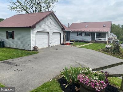 Picturesque setting with this 4 bedroom, 2 full bath home situated on 2.97 acres in Delaware Twp! Beautifully landscaped with large fenced upper yard with treehouse & play area with a slide & cargo net! Huge level lower yard with a stream! Large kitchen dining combo w appliances included! First floor laundry! Mudroom. Living room, 3 bedrooms & full bath also on first floor! Basement features Family Room, Owners bedroom & full bath. Oil hot water heat plus Wood stove that heats the water also. Central air! Wired for a generator. Water filter & softner. Well & septic. Large attic for storage. 2 car detached with storage to the rear. Awesome screened in pavillion with rear deck & grill station. Blacktop drive. Across the street is a 2 bay older garage/storage building.
